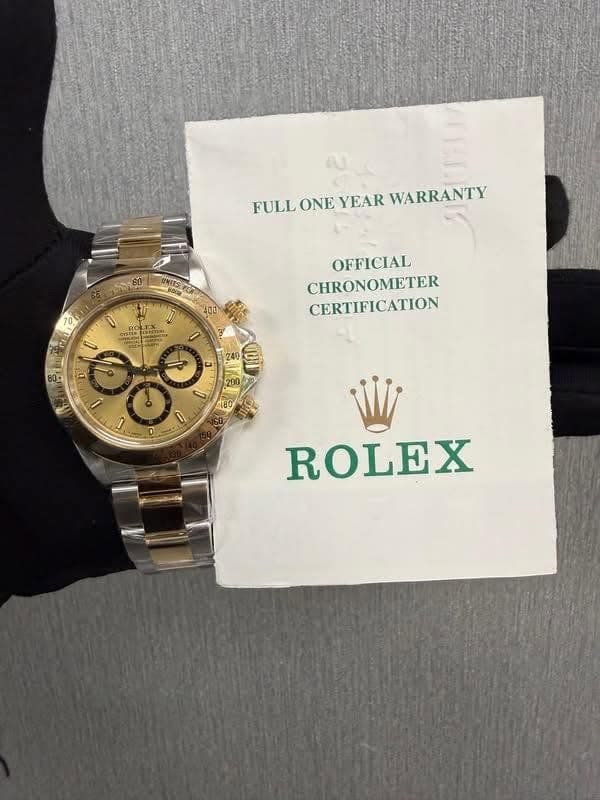 May be an image of wrist watch and text that says 'FULL ONE YEAR WARRANTY 400 CYSTOR U OFFICIAL CHRONOMETER CERTIFICATION 60 D 法 D ب 0 ROLEX'