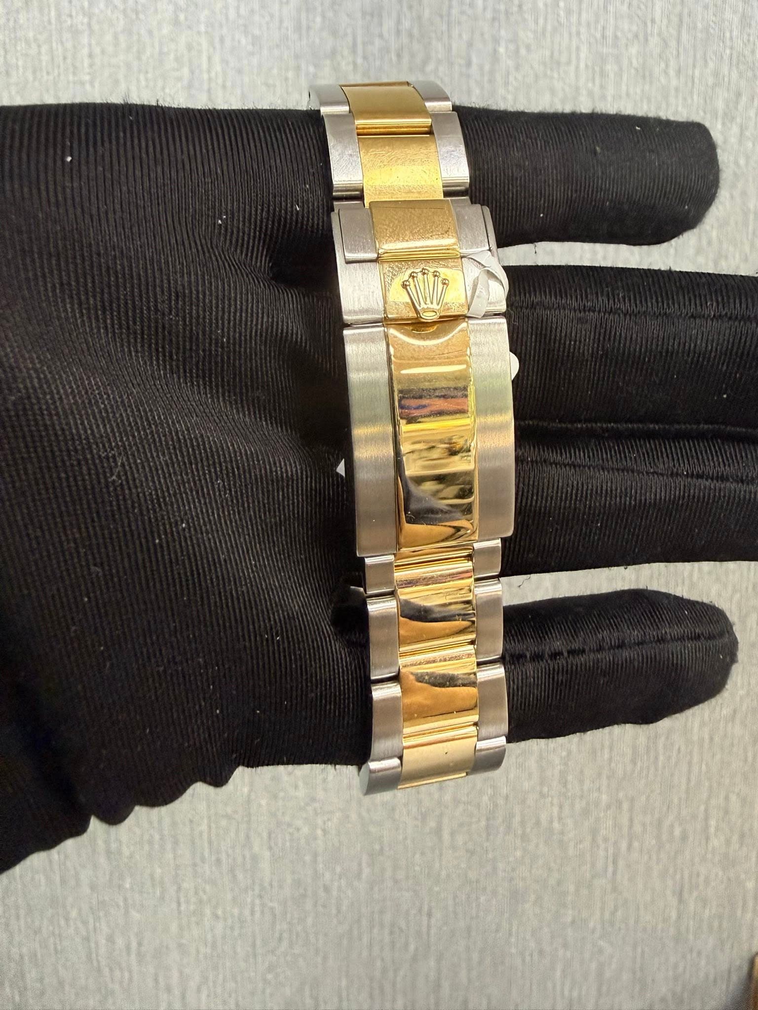 May be an image of wrist watch and jewelry