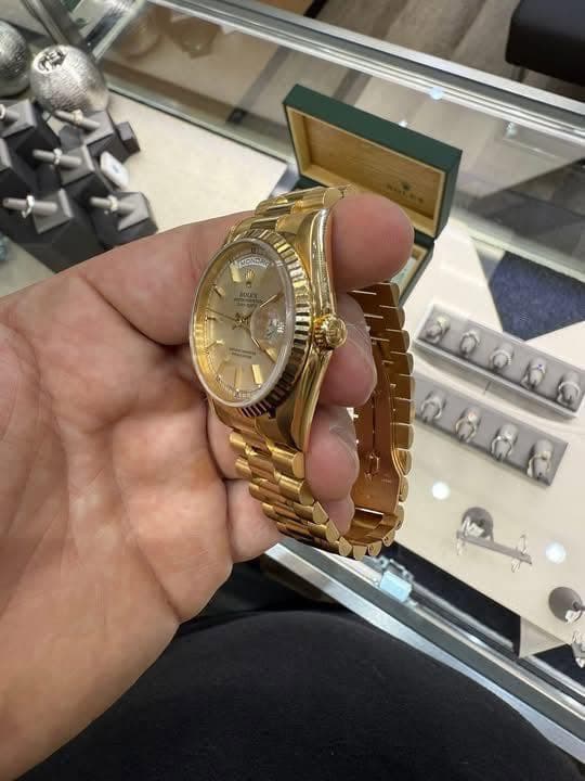 May be an image of wrist watch and text