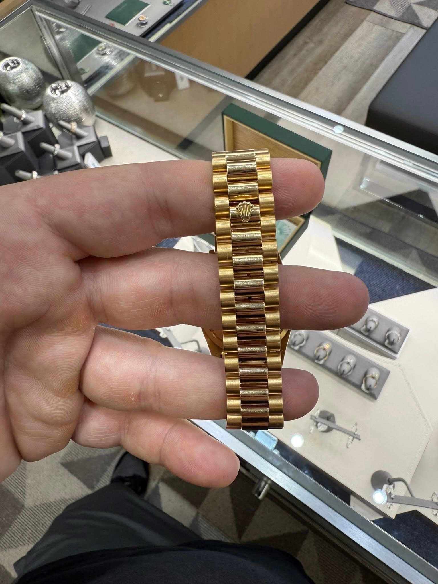 May be an image of wrist watch and text