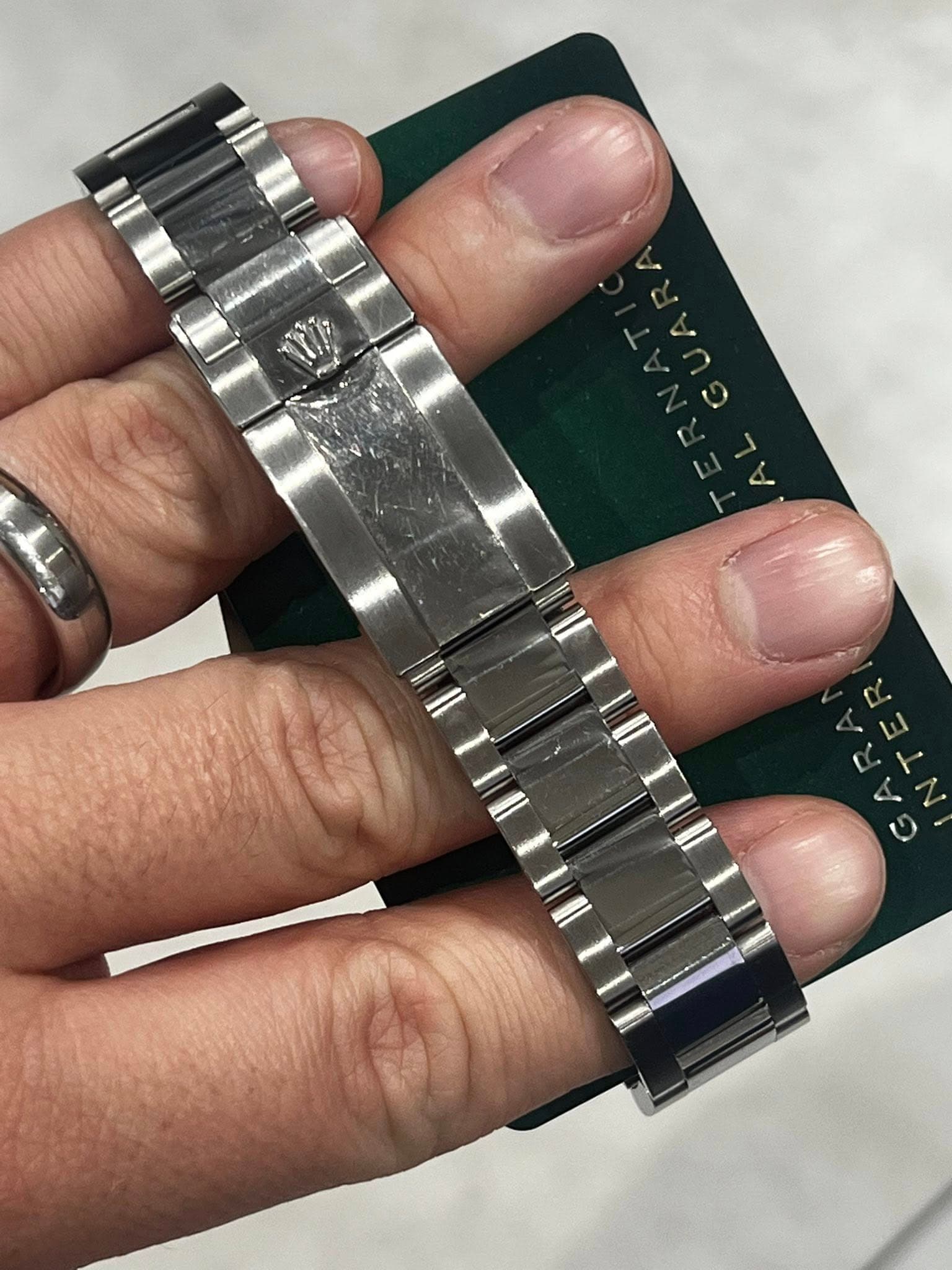 May be an image of wrist watch and text