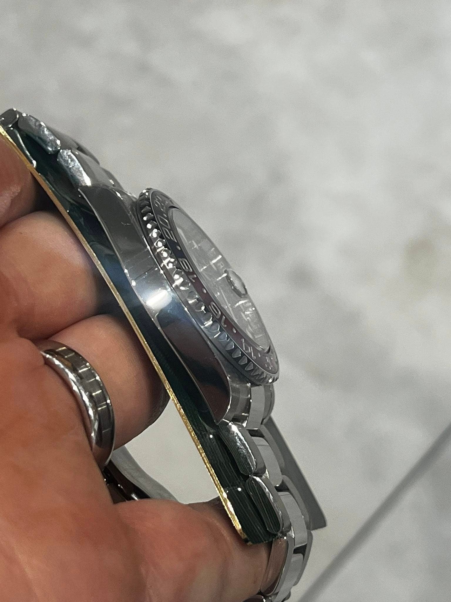 May be an image of wrist watch and text