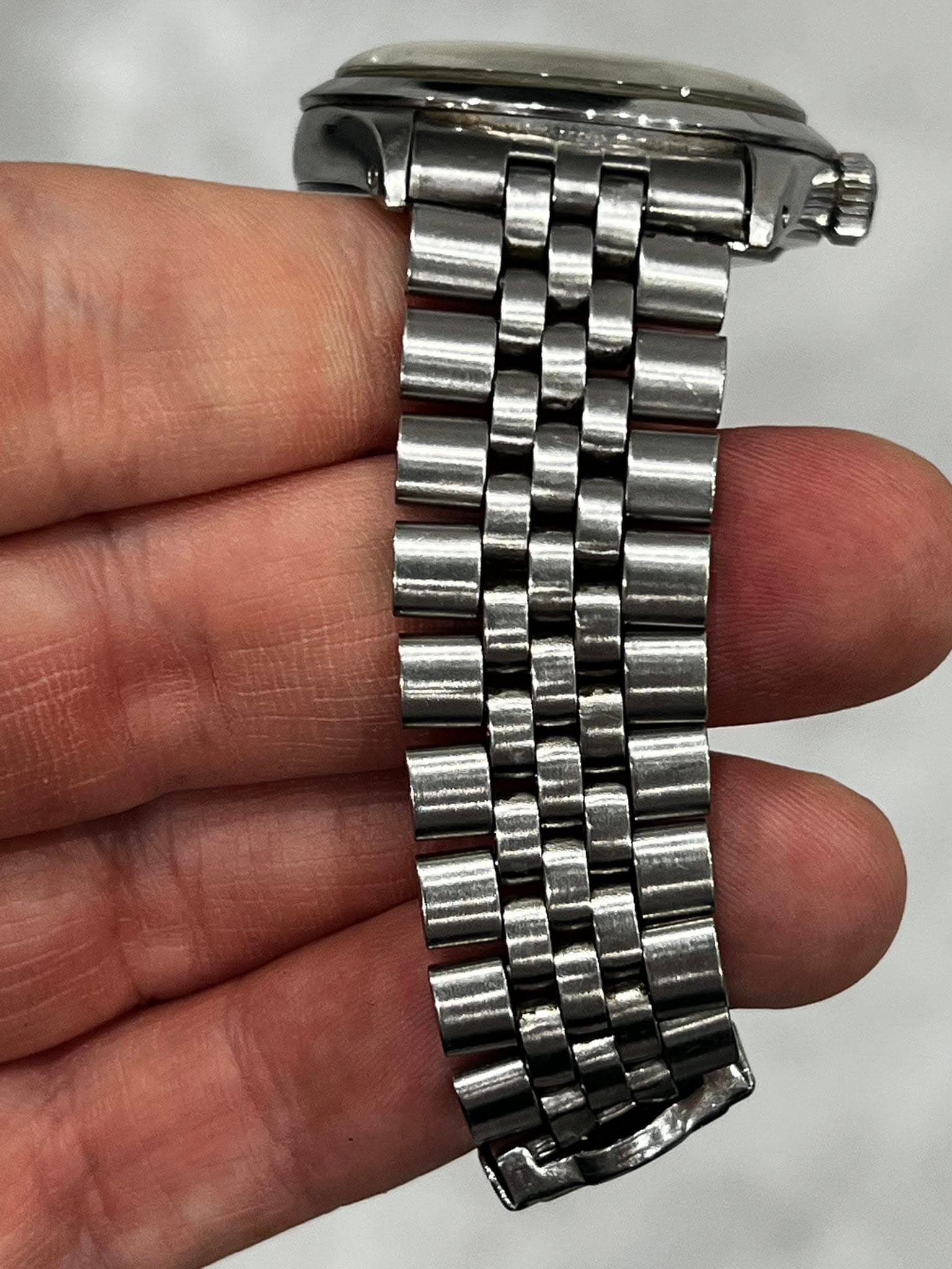 May be an image of wrist watch