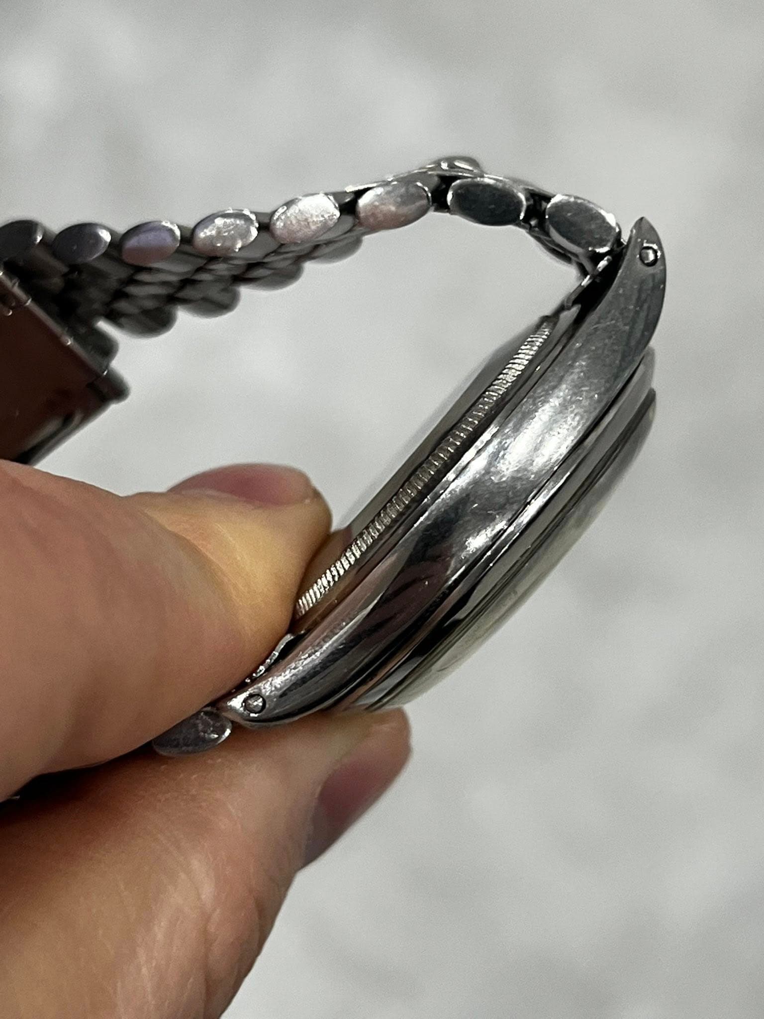 May be an image of wrist watch and jewelry
