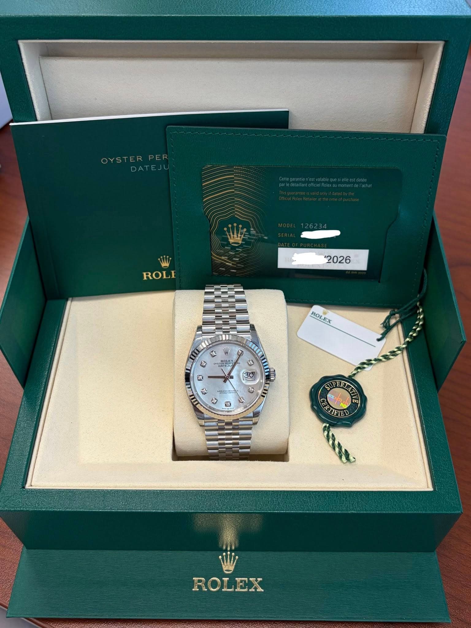 May be an image of wrist watch and text that says 'ROLE "2026 ROLEX U い TE 3 ・. 2ี ひ ج ف OFBL ROLEX'