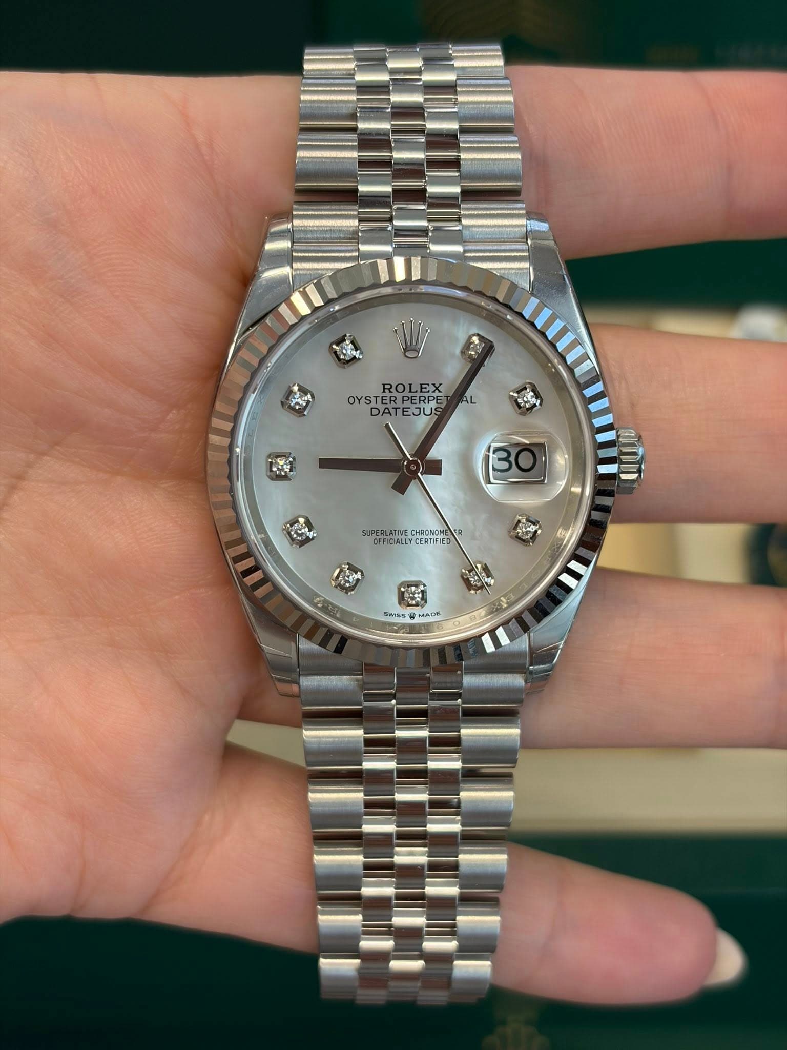 May be an image of wrist watch and text