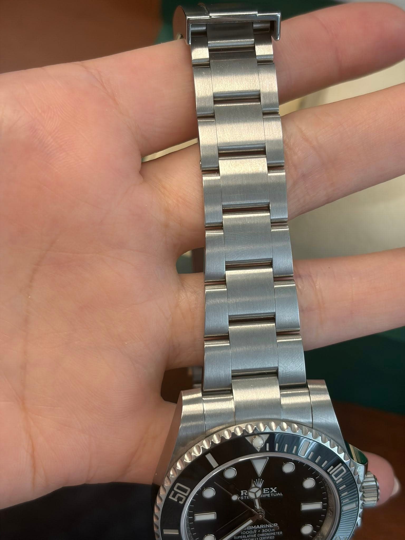 May be an image of wrist watch and text