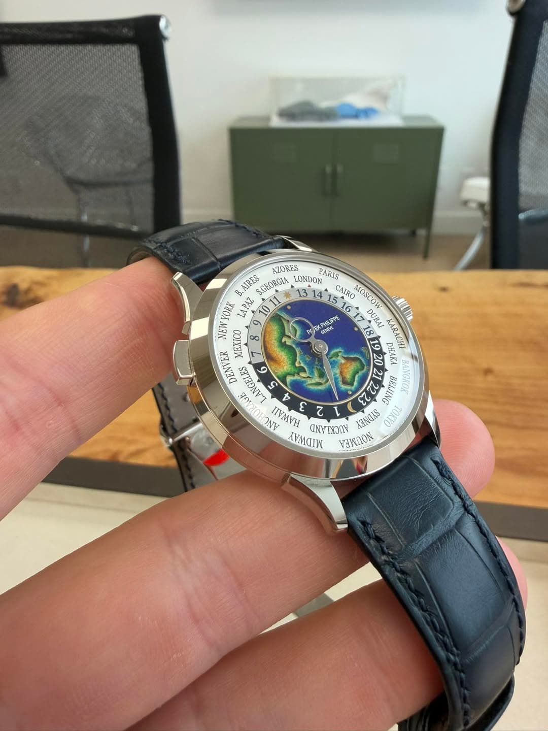 May be an image of wrist watch and text