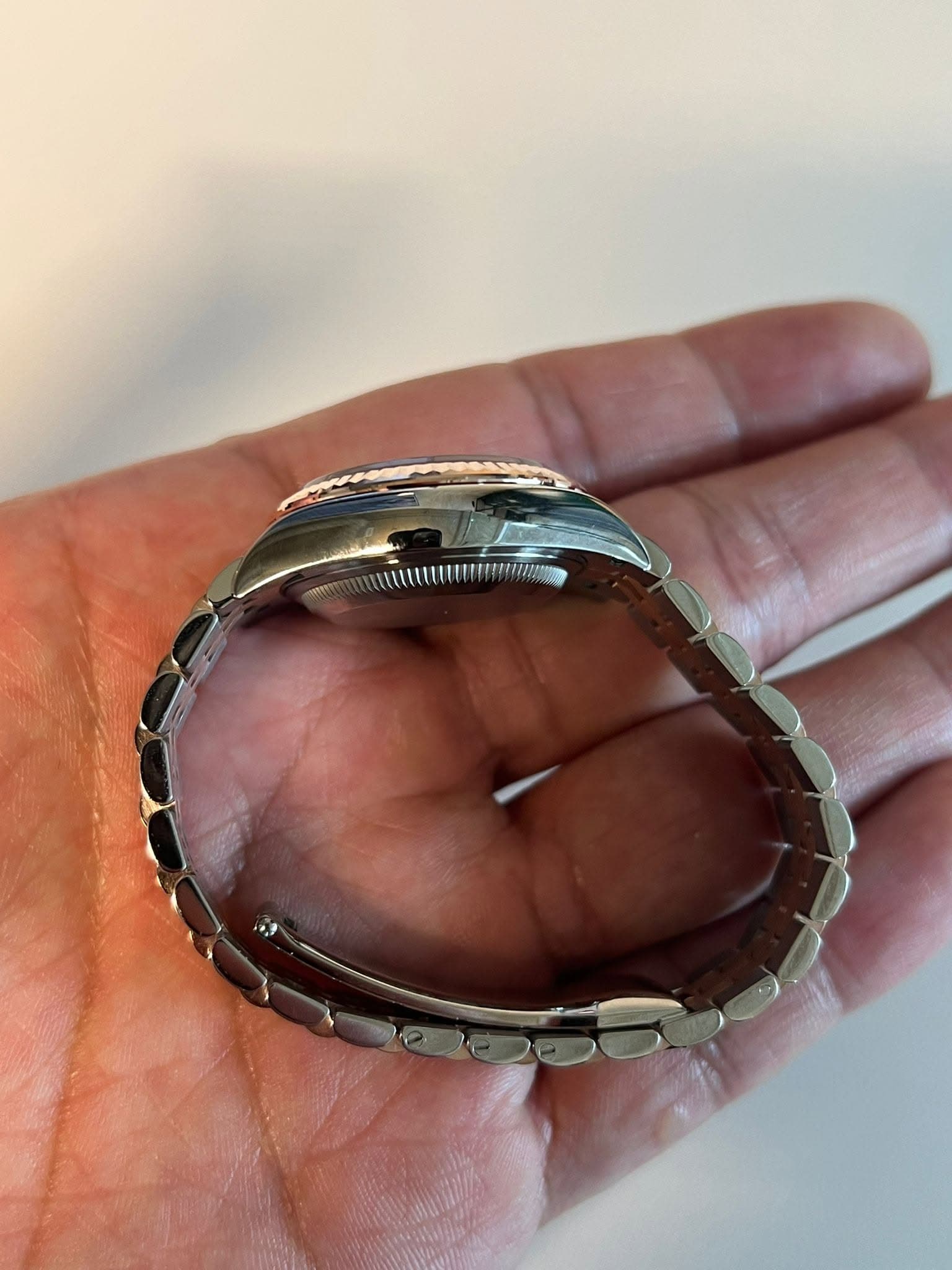 May be an image of wrist watch and ring