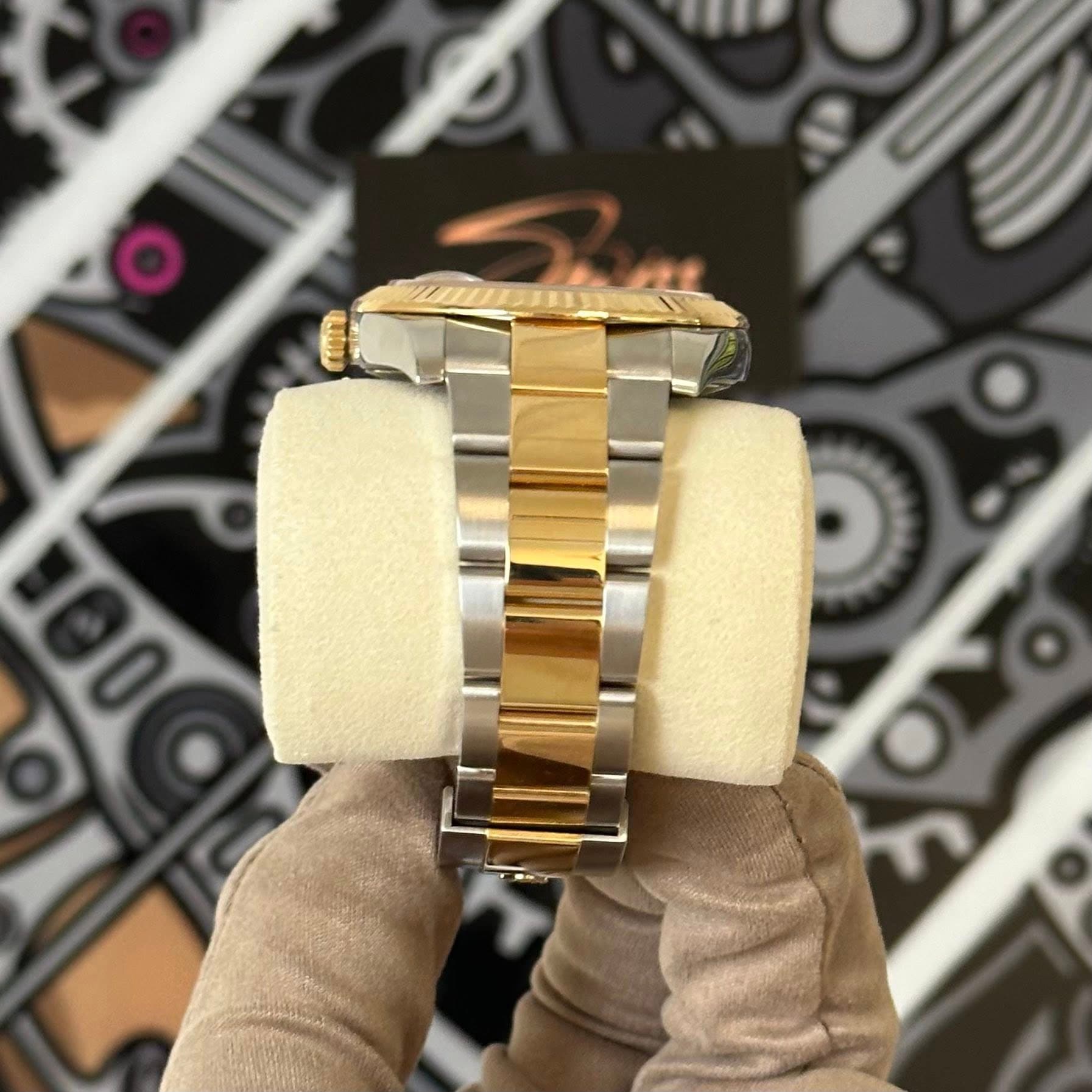 May be an image of wrist watch and text