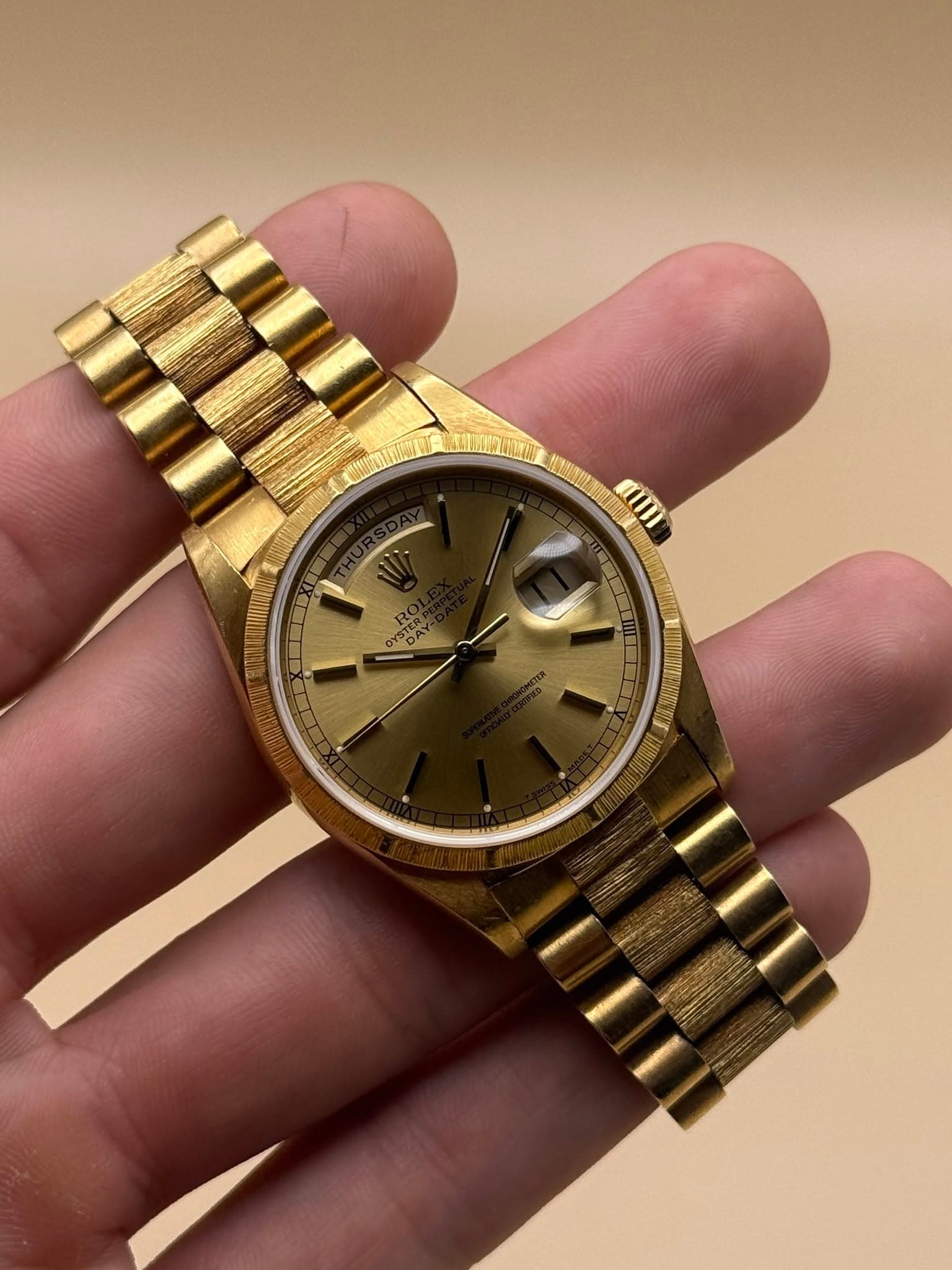May be an image of wrist watch and text