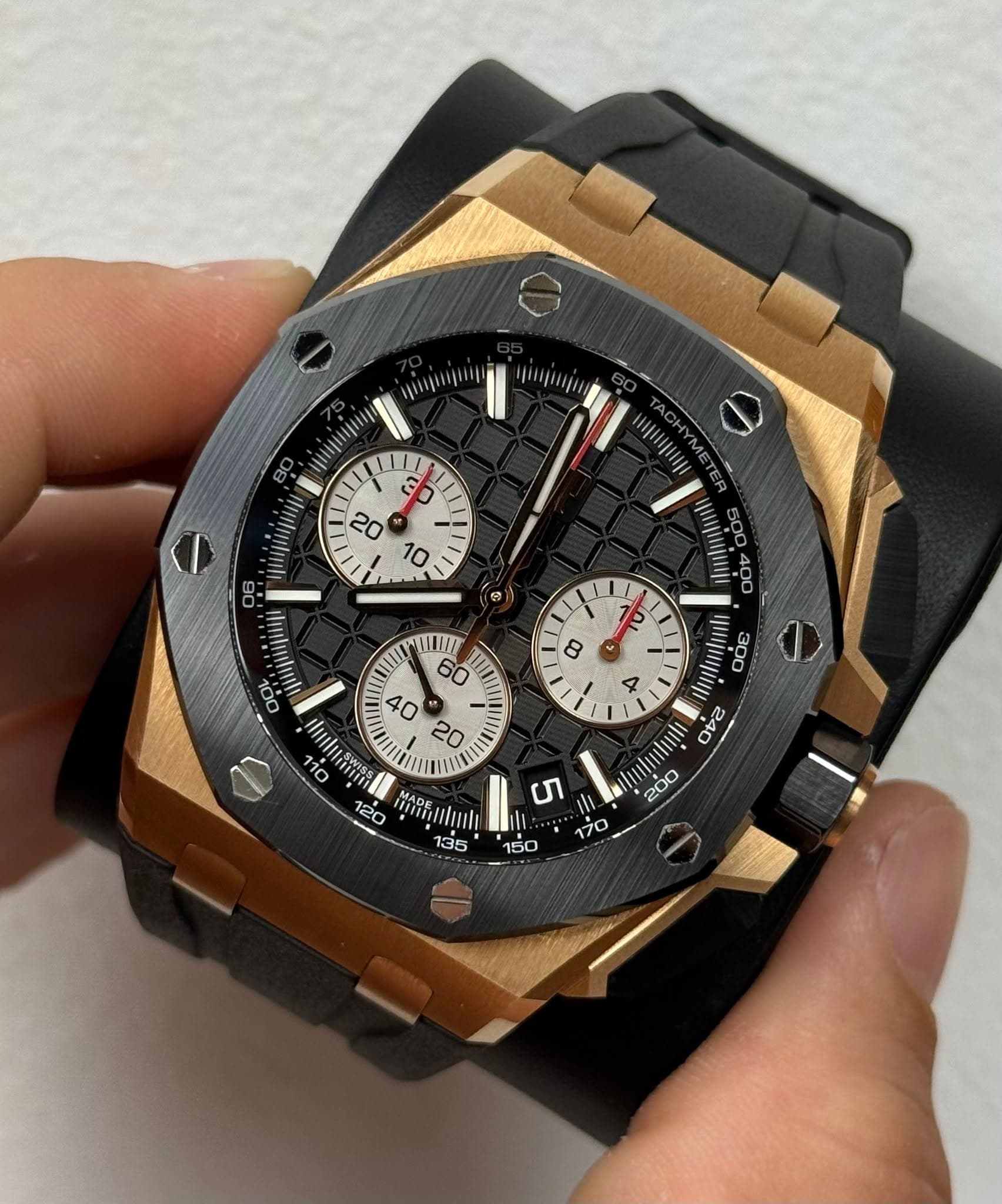 May be an image of wrist watch and text