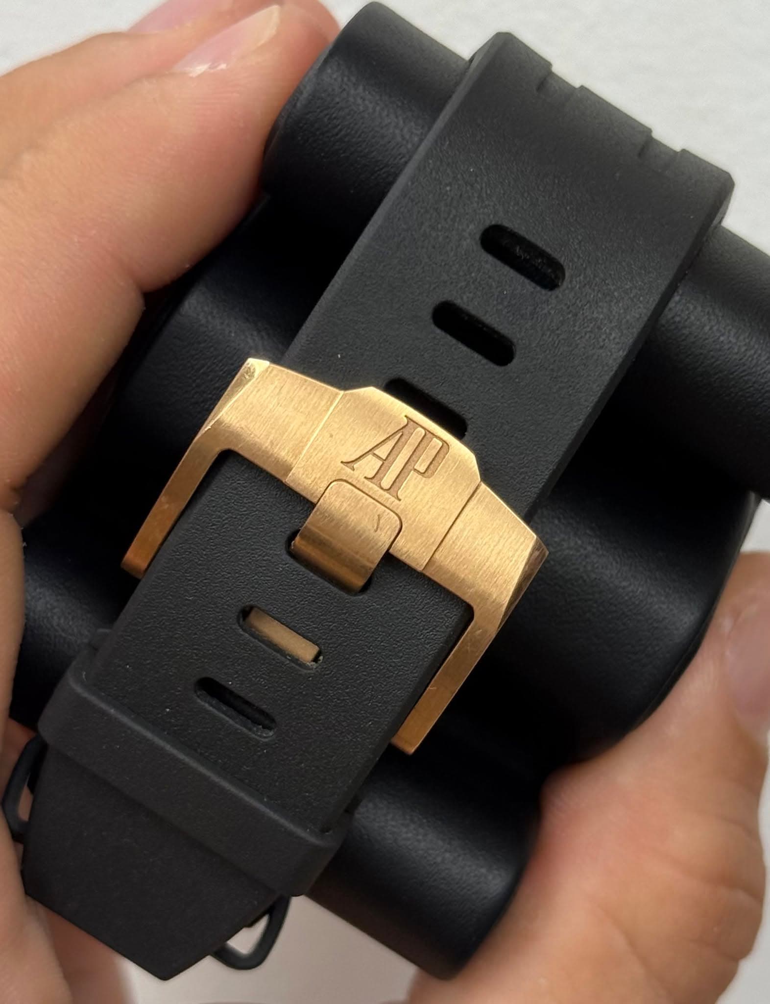 May be an image of digital watch and brass