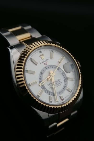 May be an image of wrist watch and text