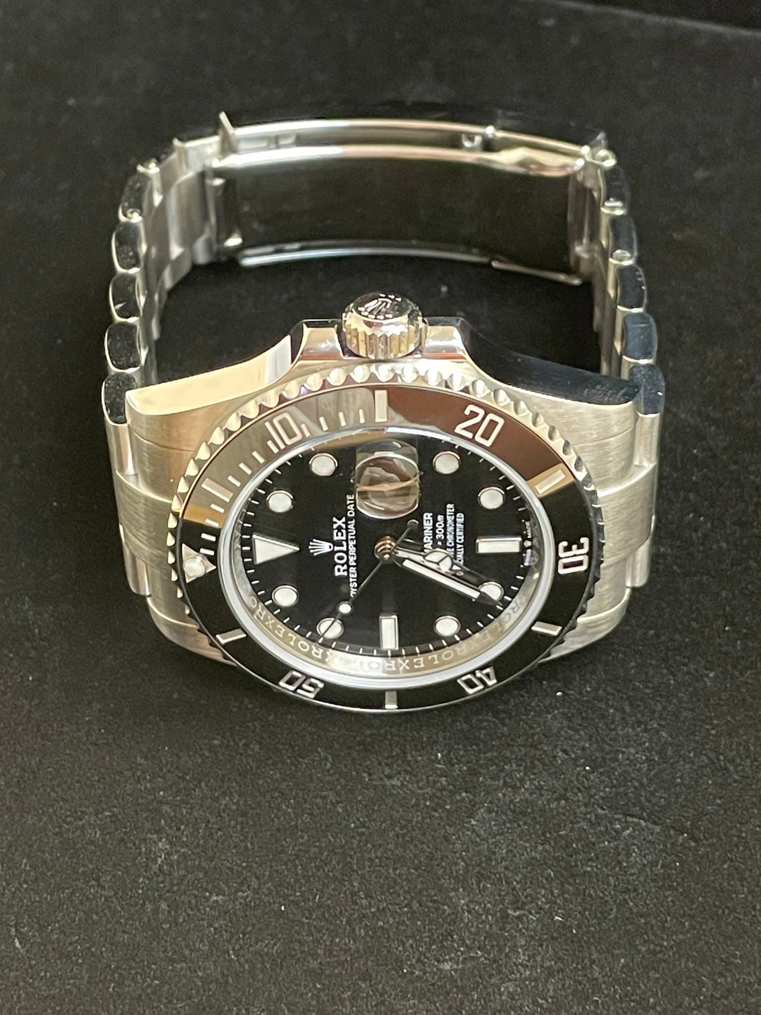 May be an image of wrist watch and text