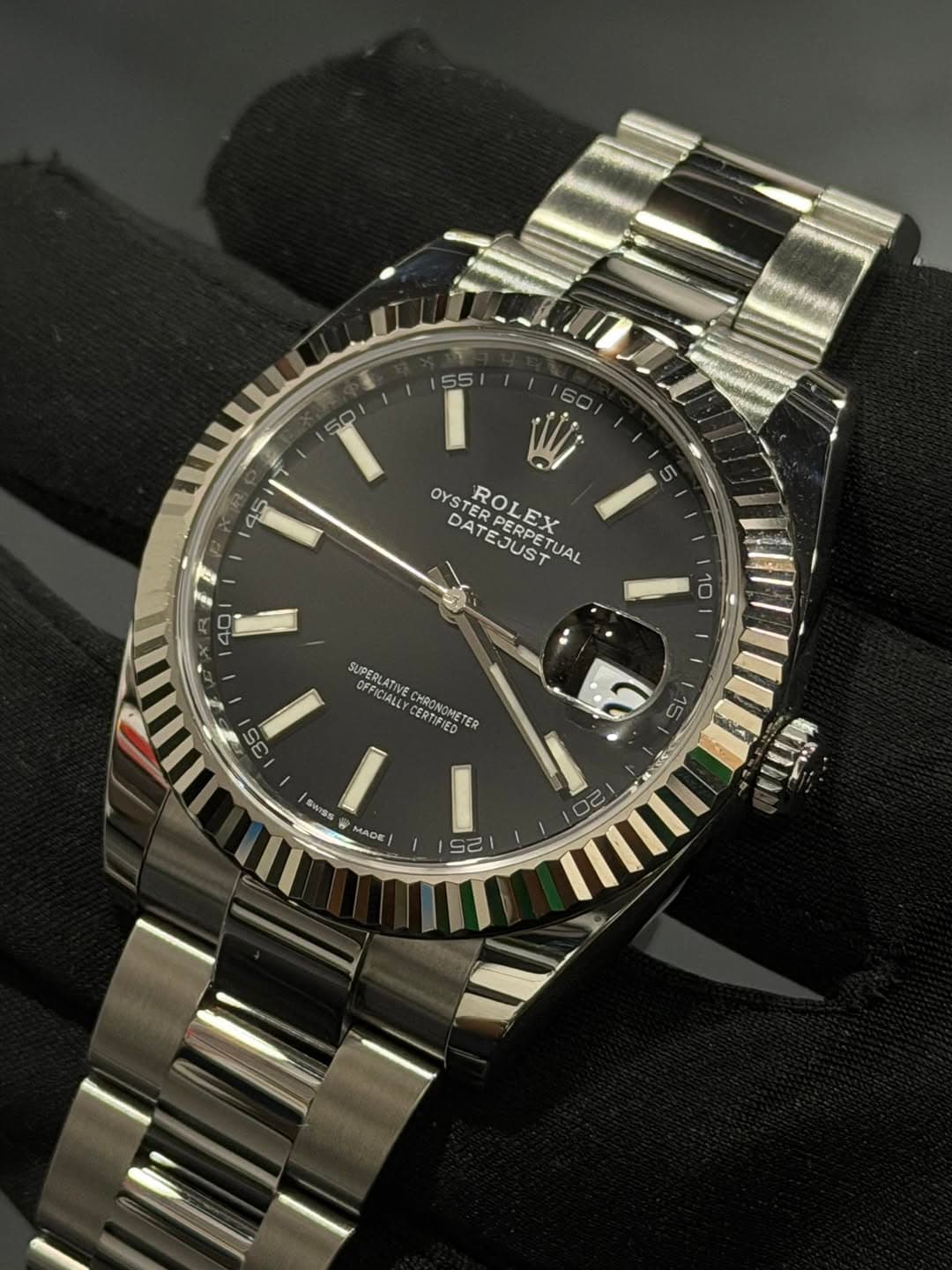 May be an image of wrist watch and text