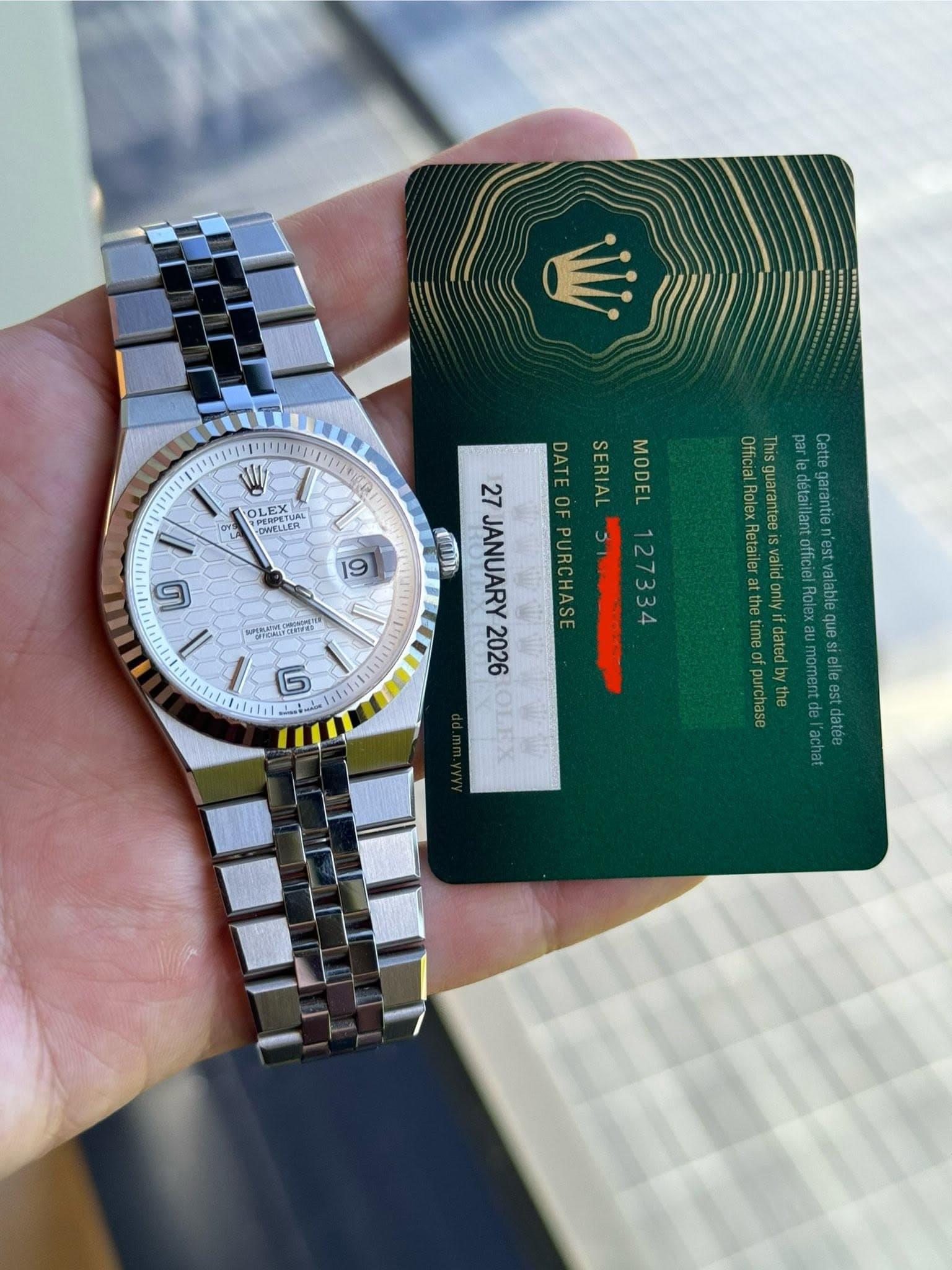 May be an image of wrist watch and text