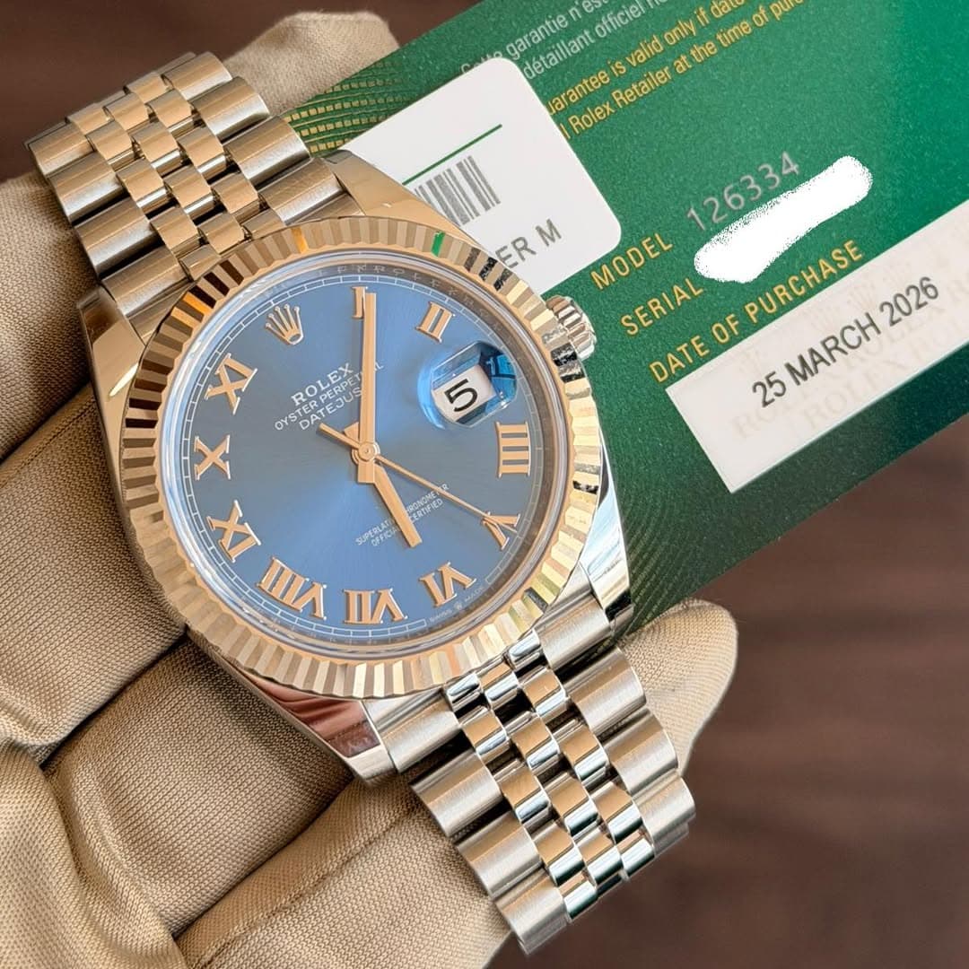 May be an image of wrist watch and text that says 'garantie es officiel only the time of pu put da détaillant valid at ar aranteei Retailer Rolex I 126334 ンて受がの生い ER M MODEL…