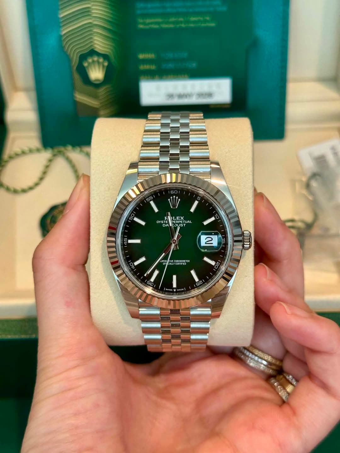 May be an image of wrist watch and text