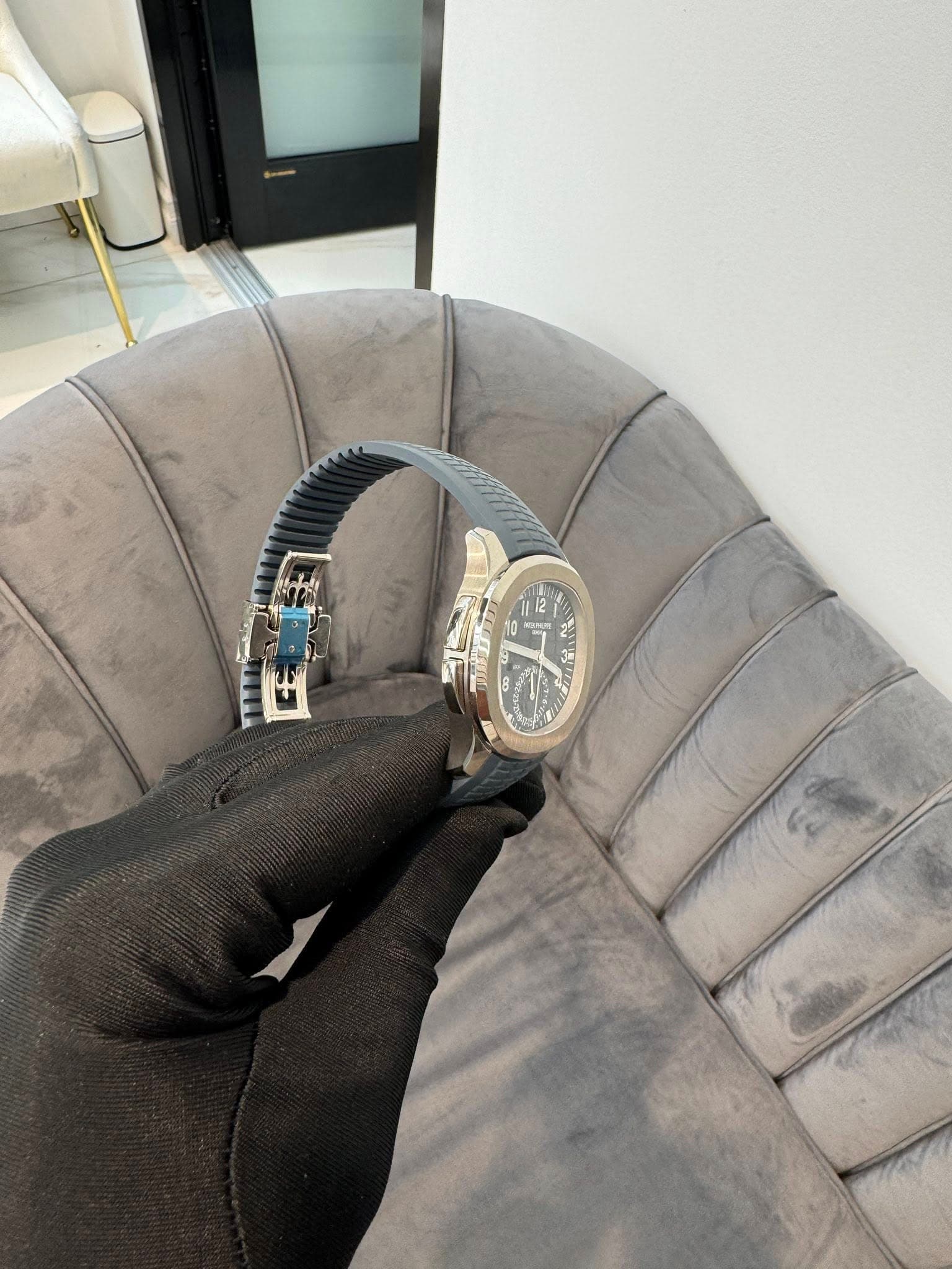 May be an image of wrist watch, leather and text