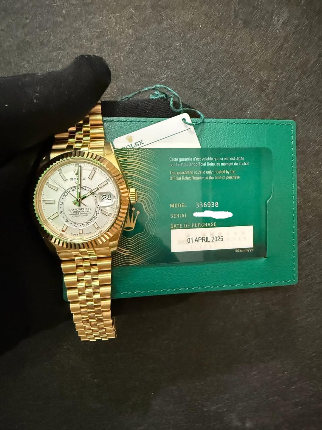 May be an image of wrist watch and text