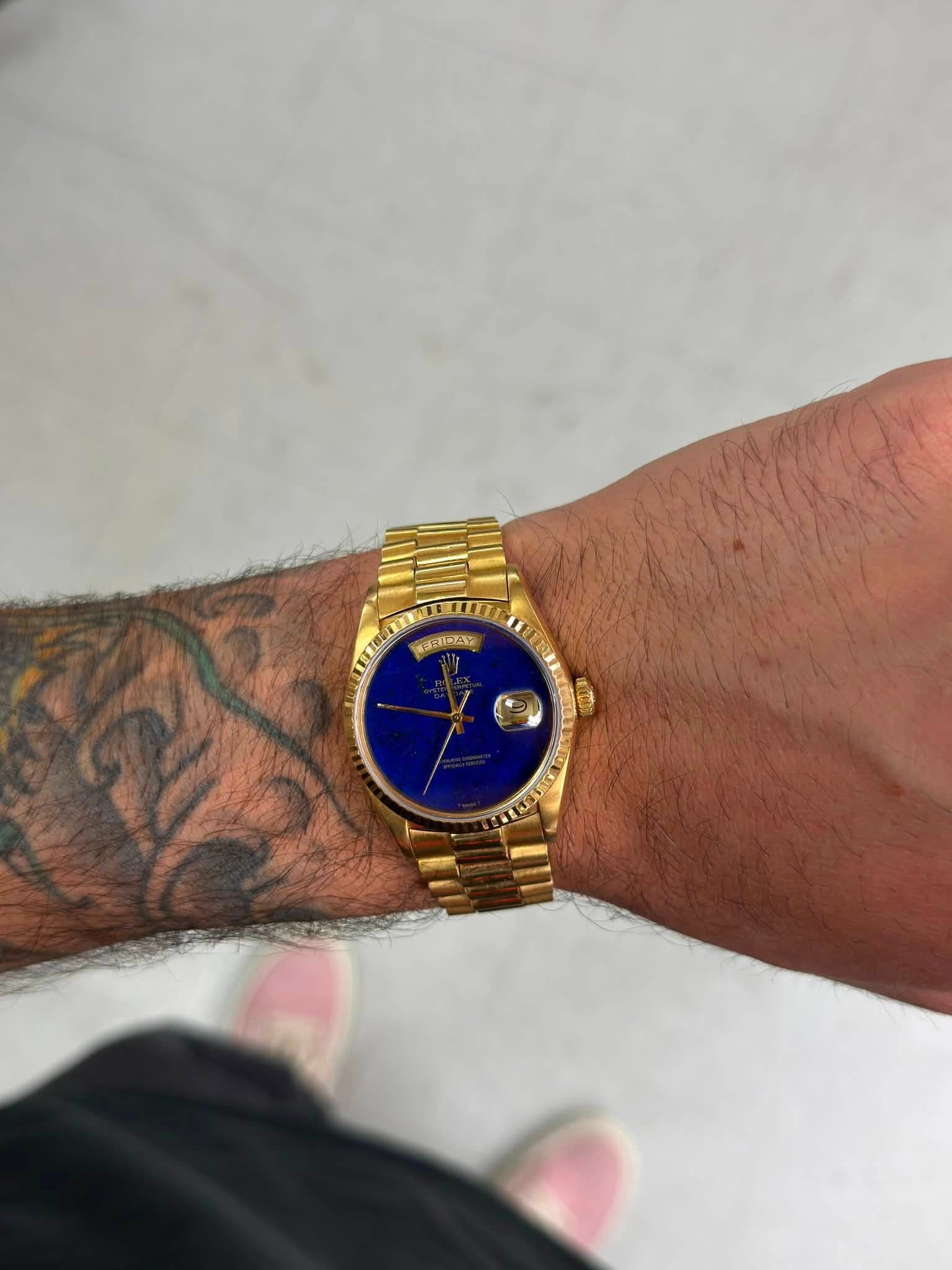 May be an image of wrist watch and text