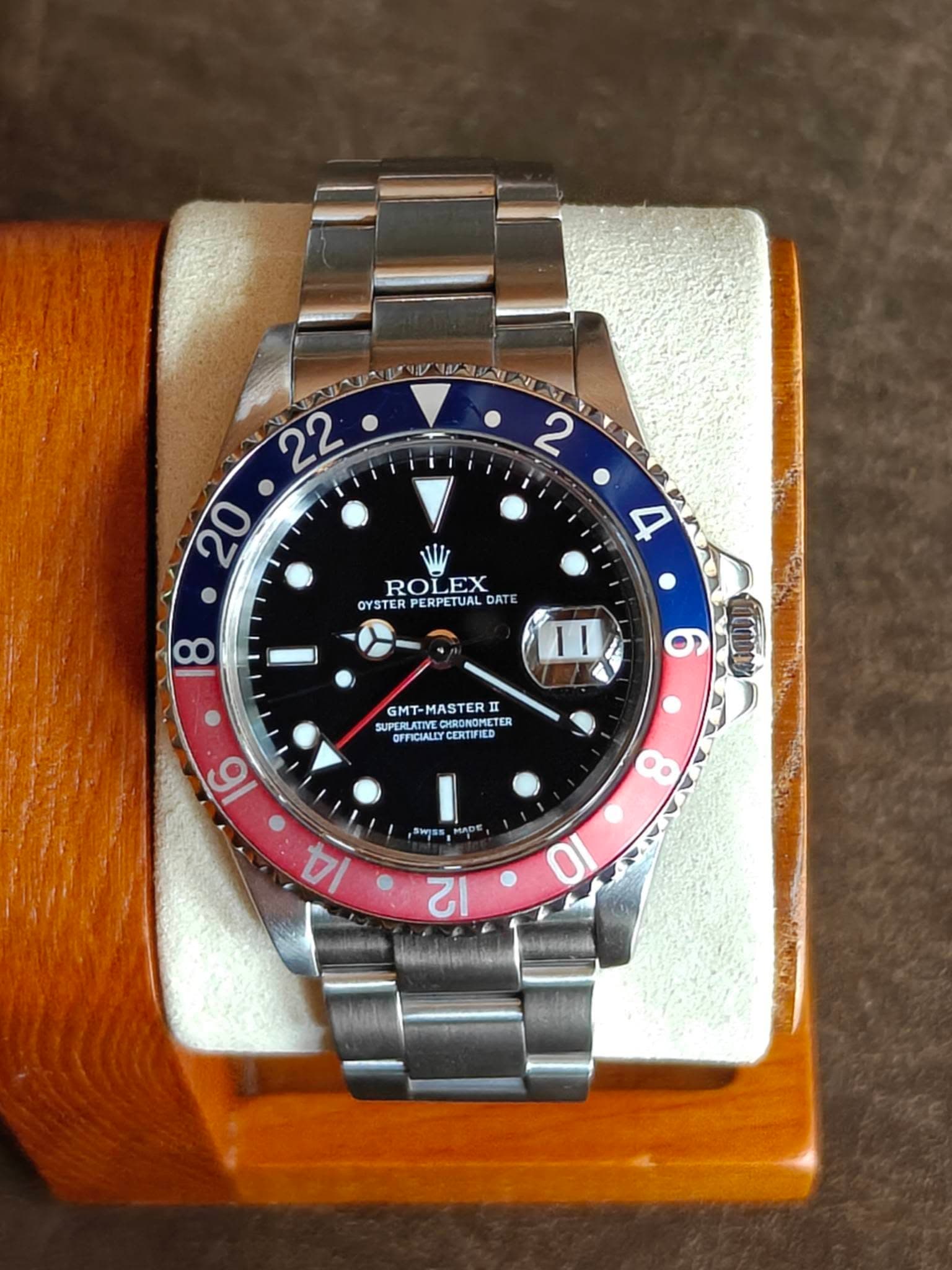 May be an image of wrist watch and text
