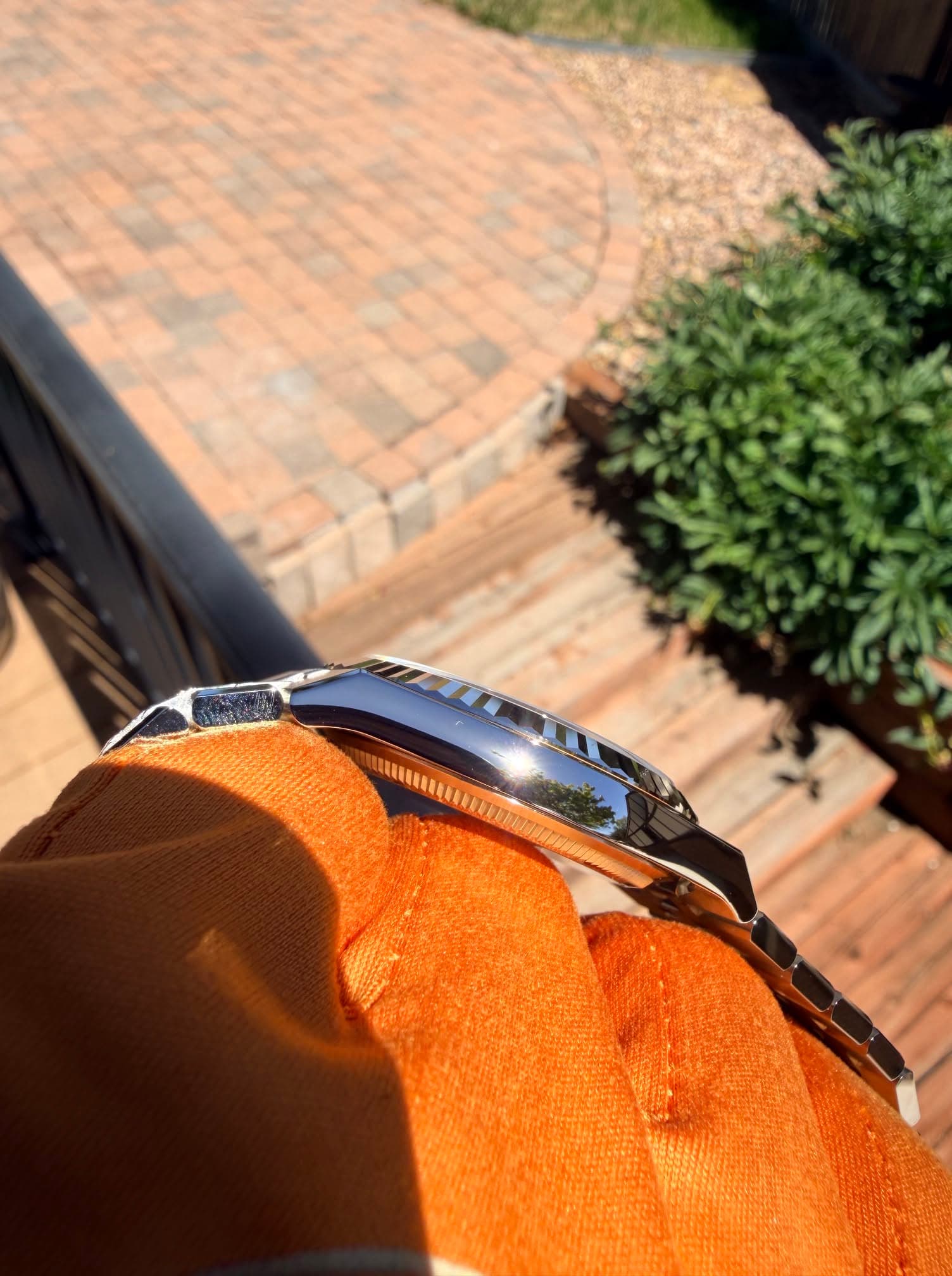 May be an image of wrist watch and saddle-stitched leather