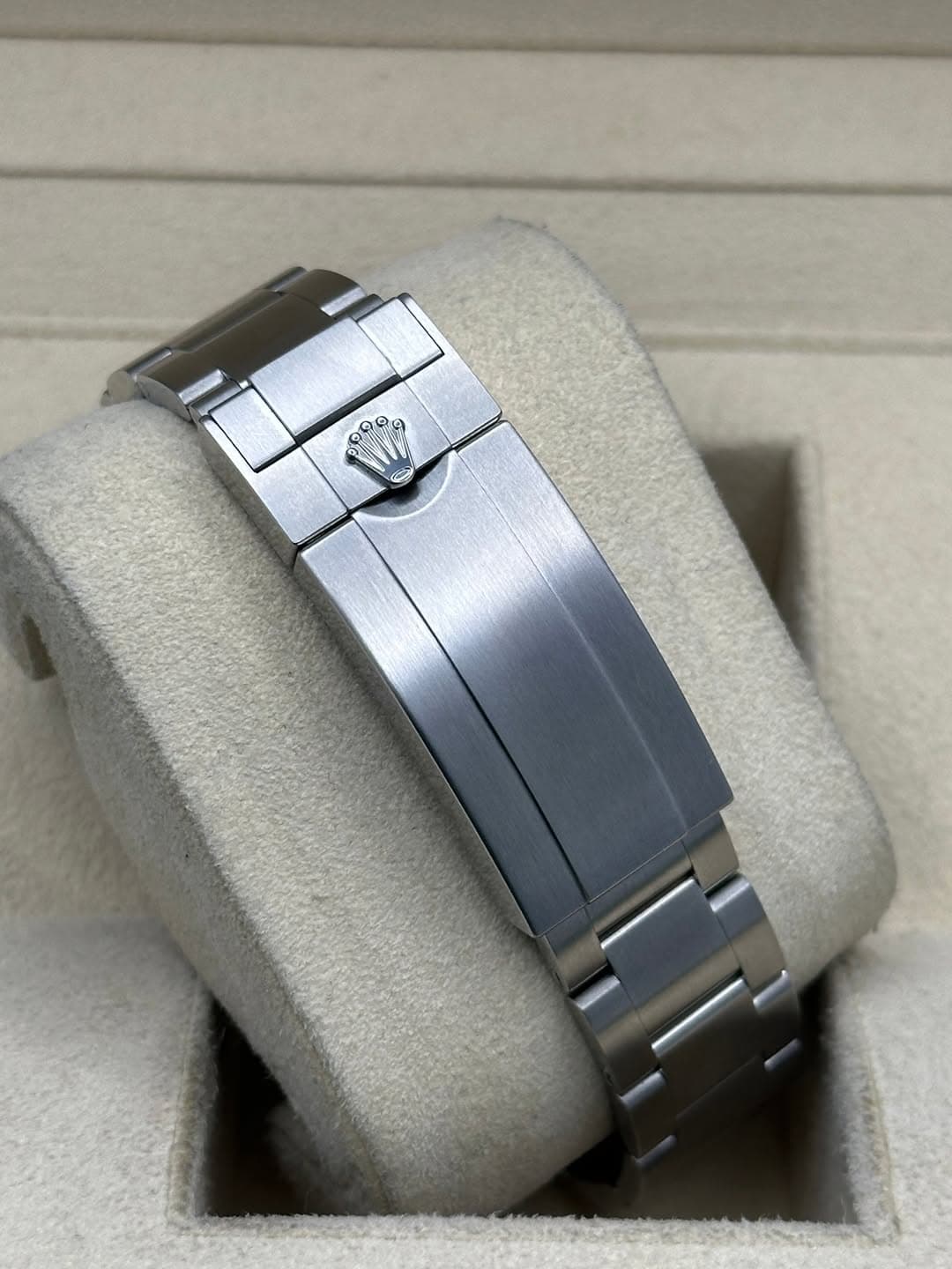 May be an image of jewelry, wrist watch and text