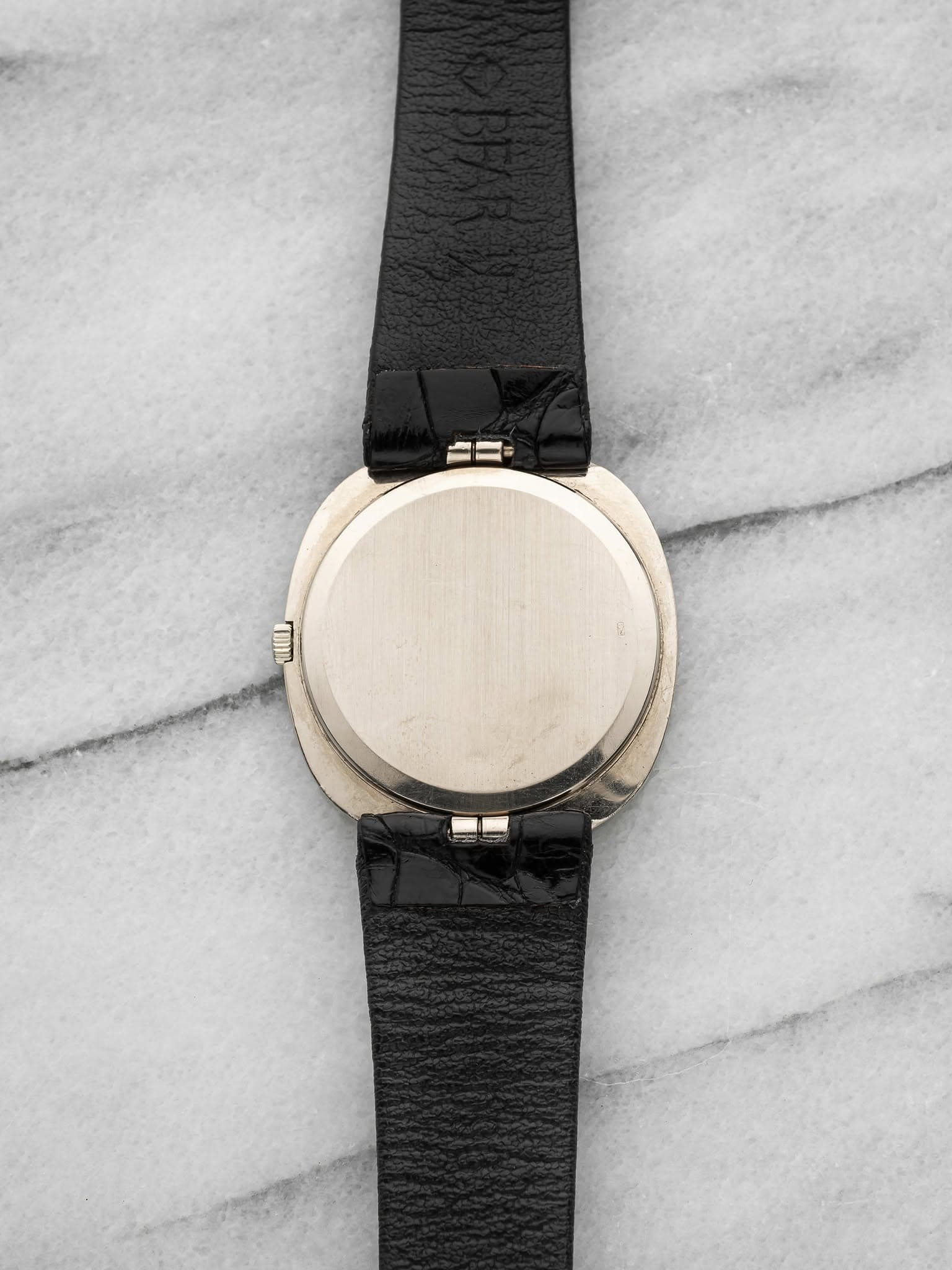 May be an image of leather and wrist watch