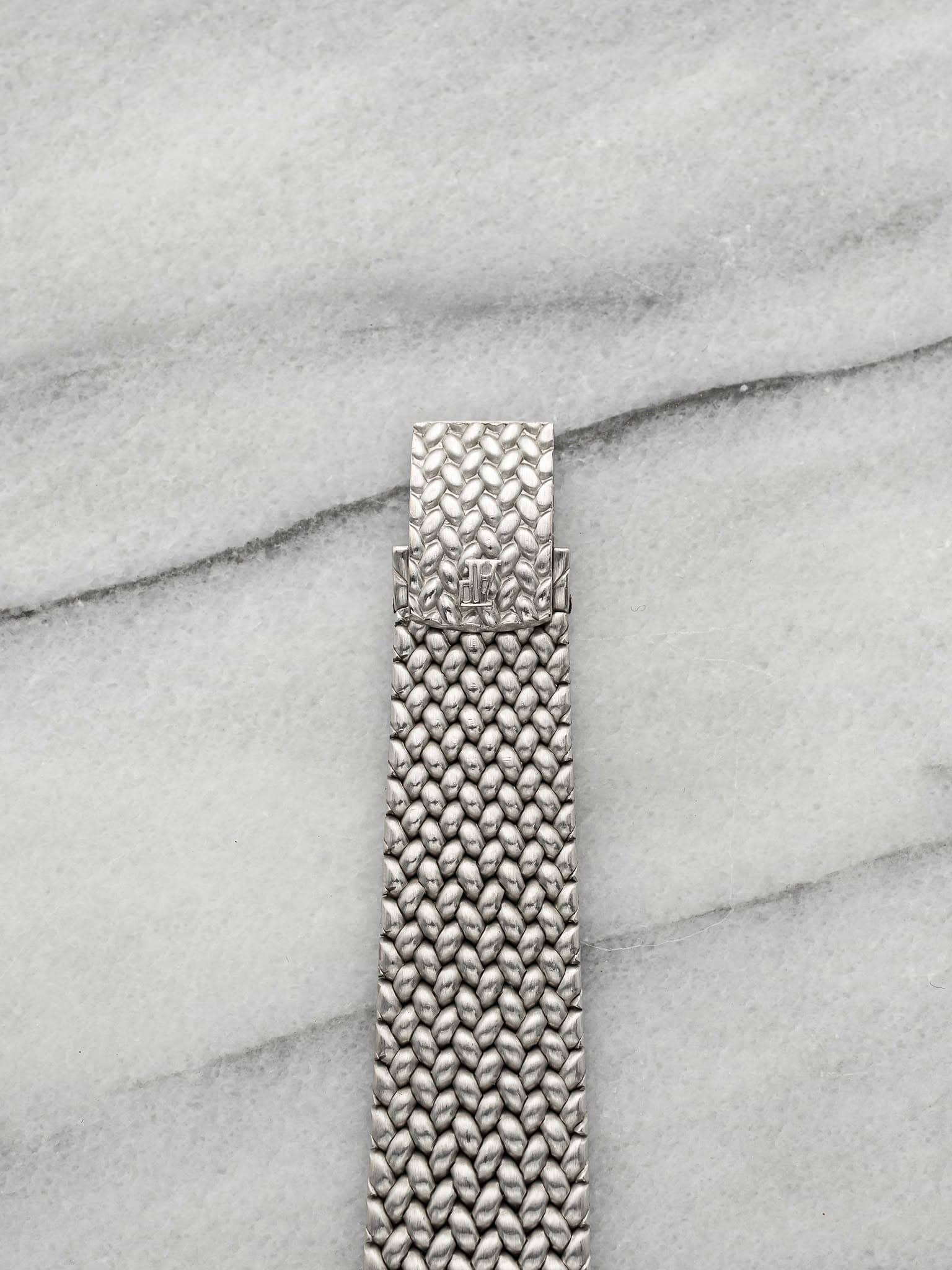 May be an image of jewelry and wrist watch