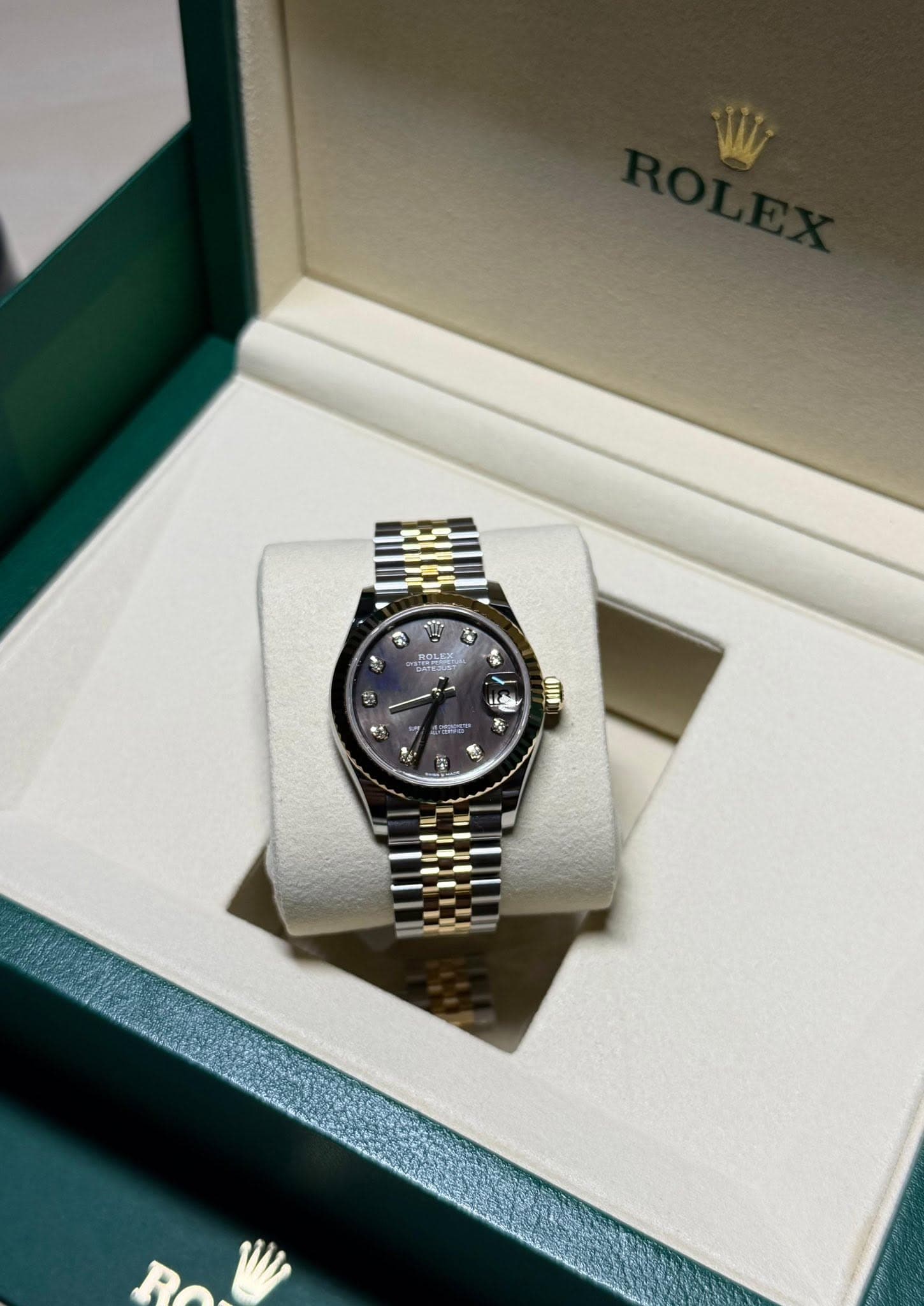 May be an image of wrist watch and text
