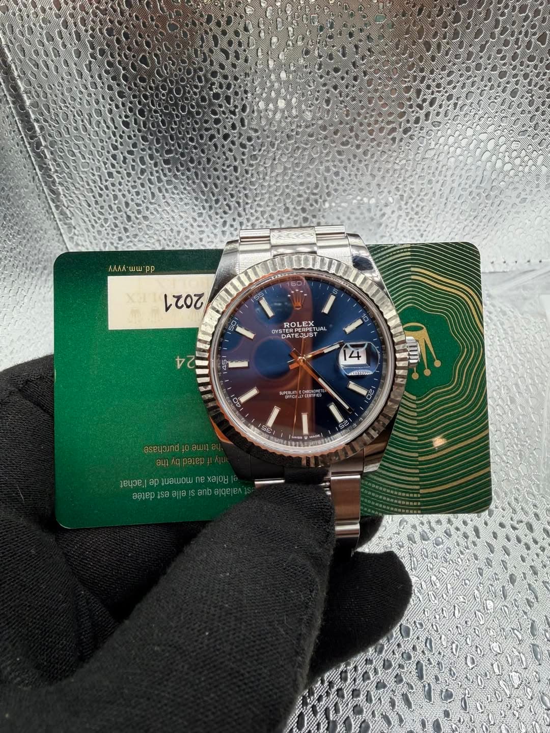May be an image of wrist watch and text