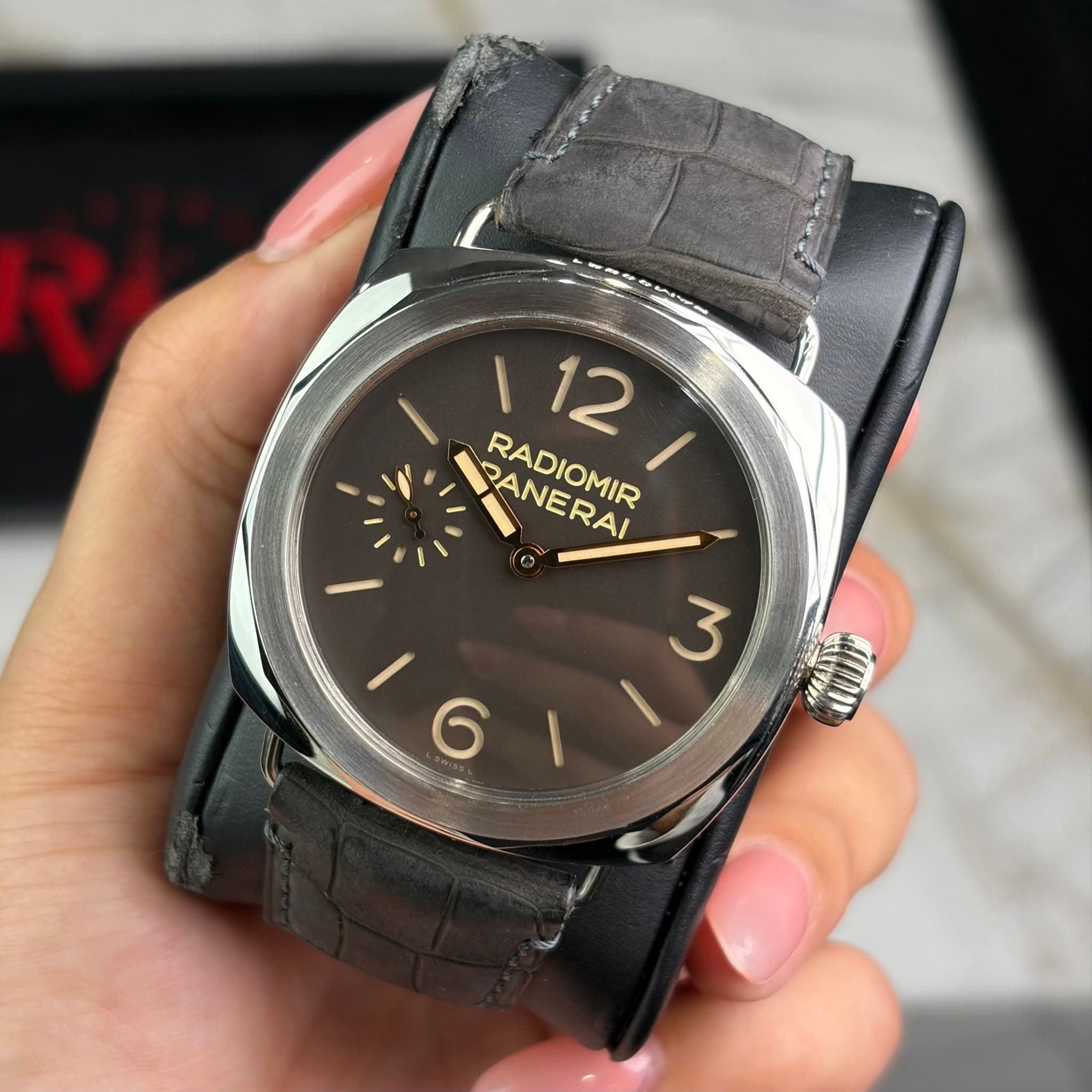 May be an image of wrist watch and text