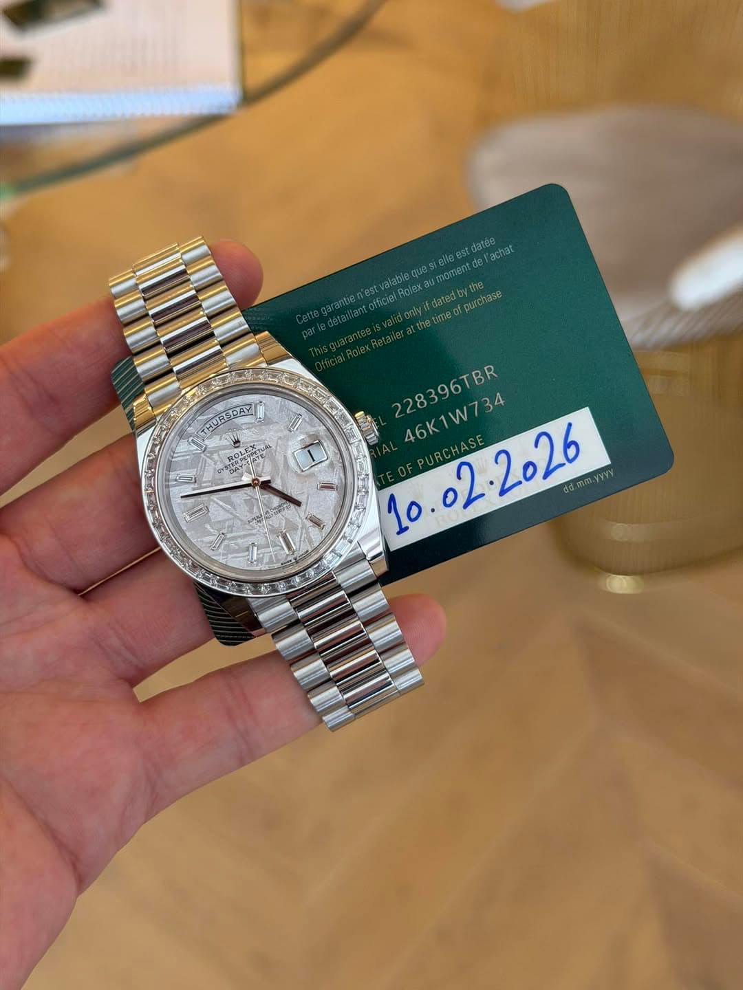 May be an image of wrist watch and text that says 'gllas Si datea lachat moment ofpurchase Du Pntex.Rotailerattna 228396TBR 46K1W734 PURCHASE 46K1 dd.mm.yyyy MURSDAY N Y'