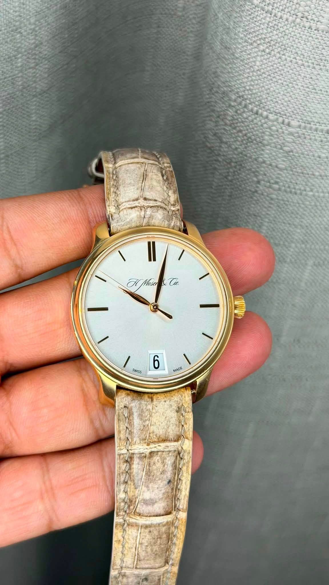 May be an image of wrist watch and text