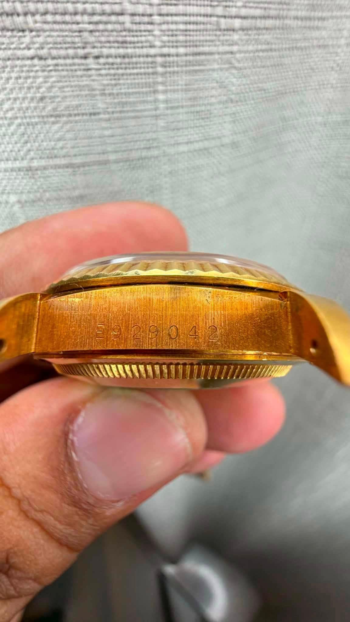 May be an image of wrist watch and brass