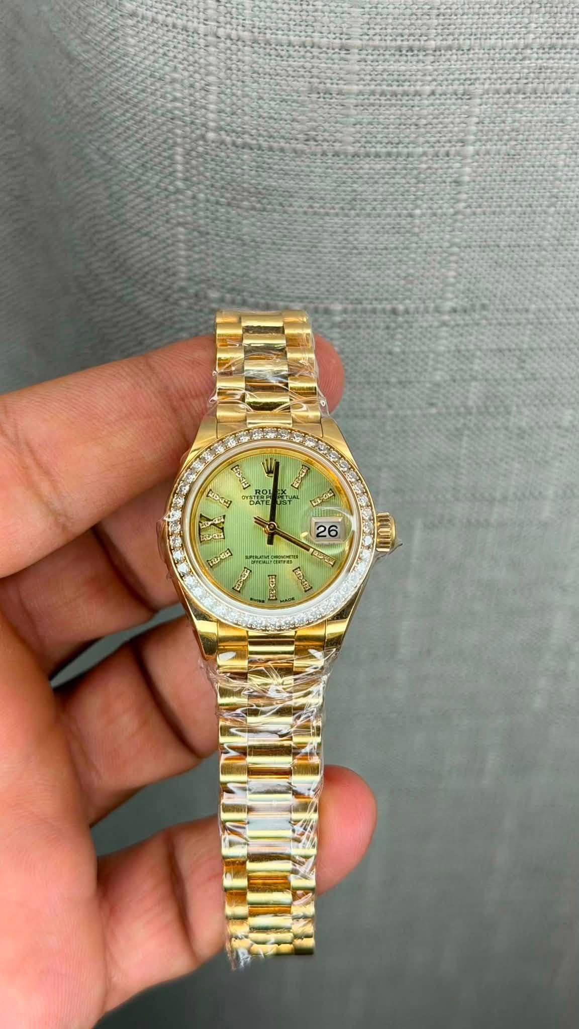 May be an image of wrist watch and text