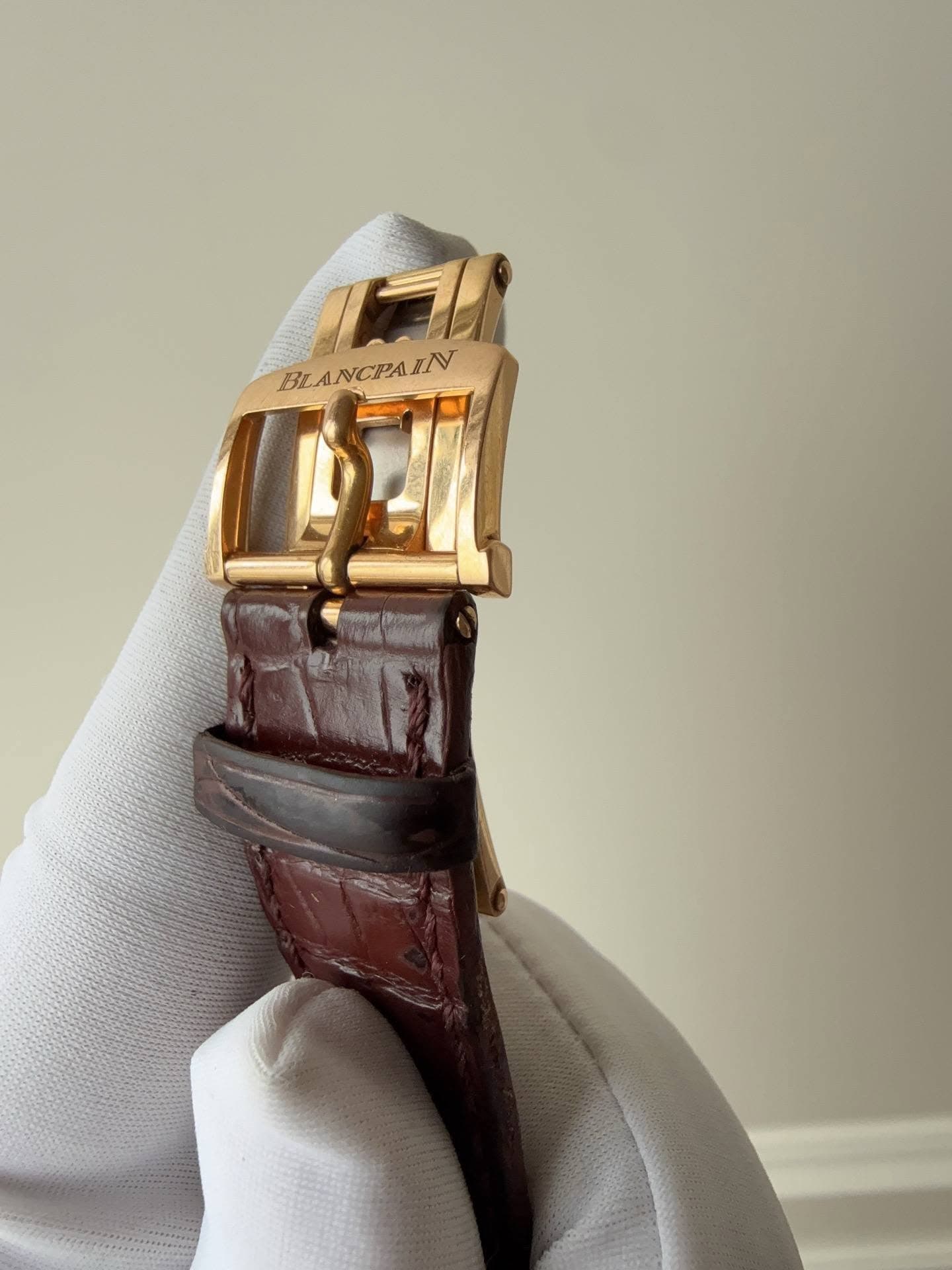May be an image of wrist watch and saddle-stitched leather