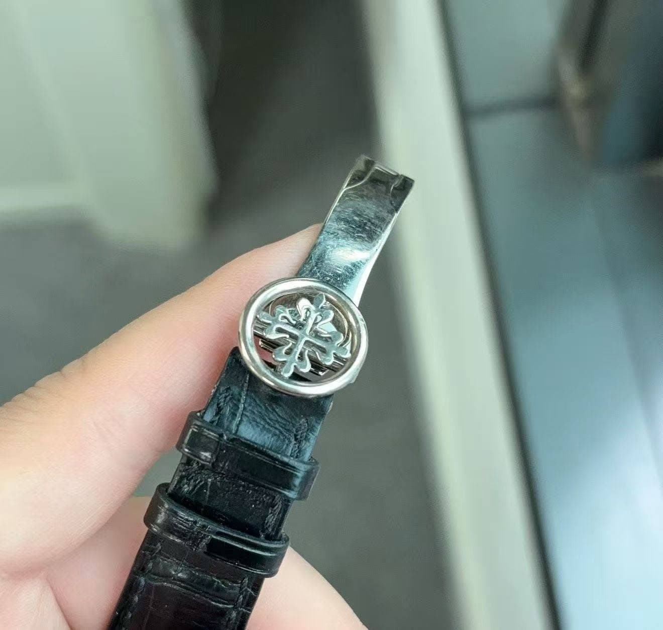 May be an image of leather and wrist watch