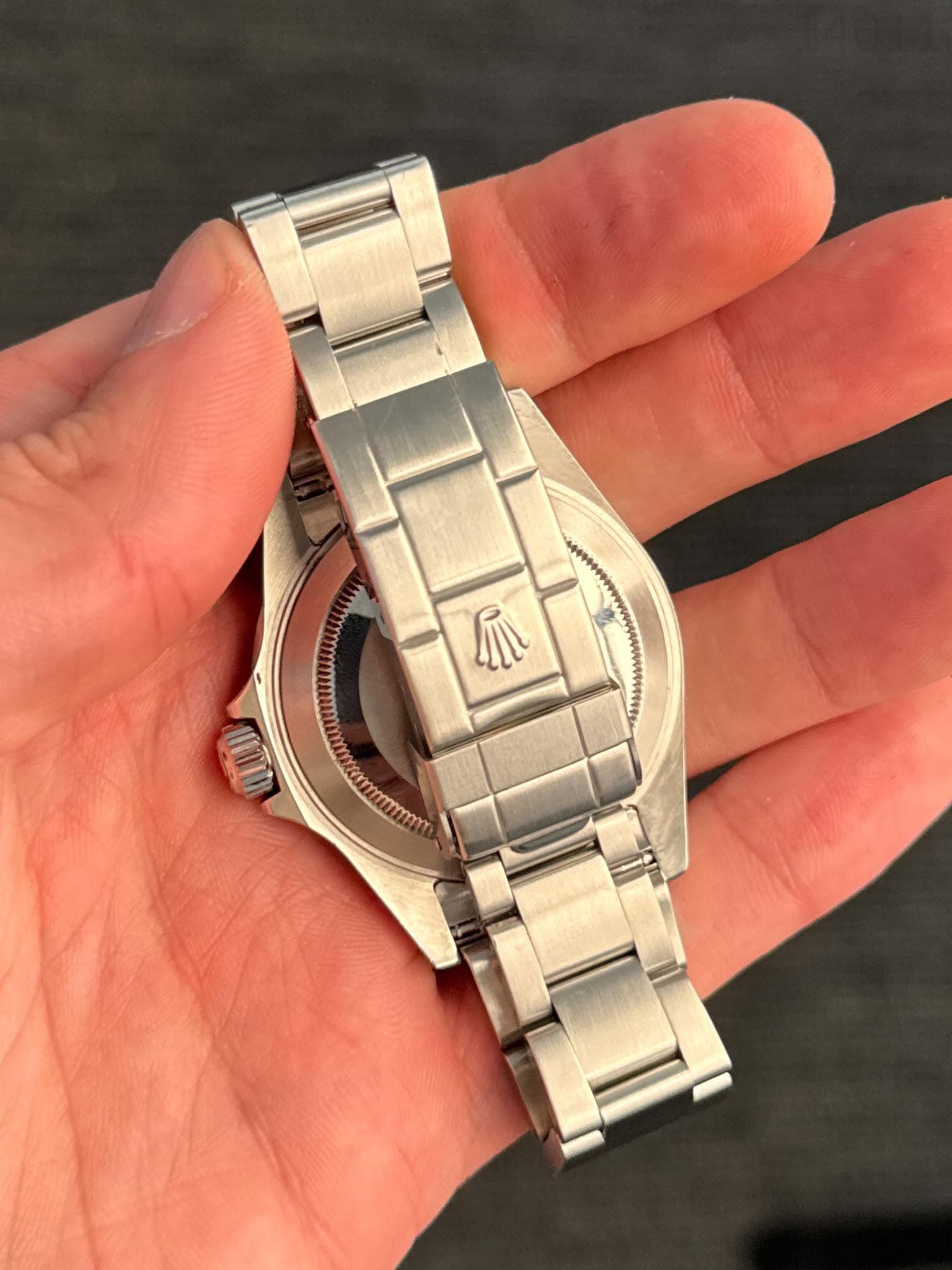 May be an image of wrist watch and text