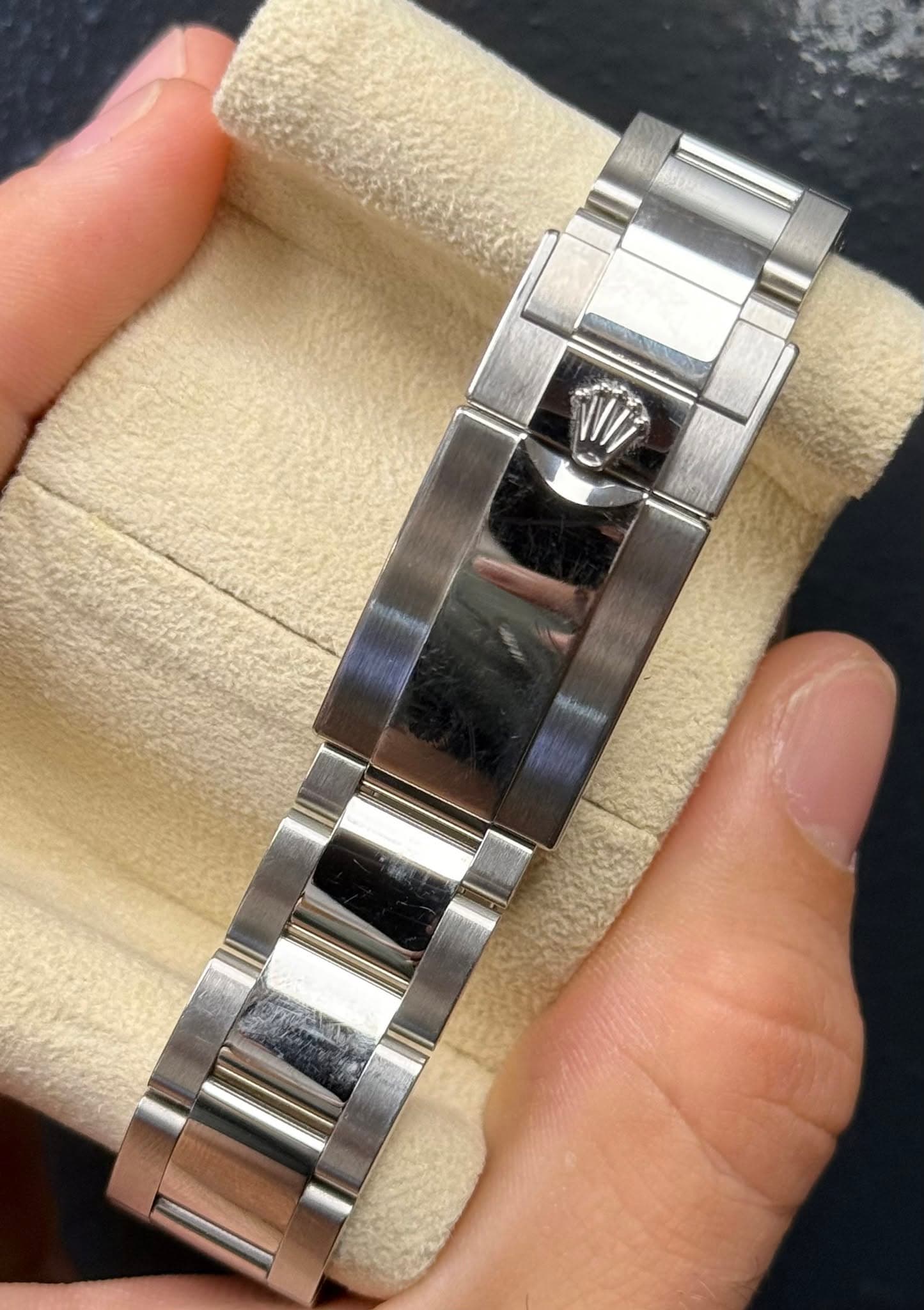 May be an image of wrist watch and text