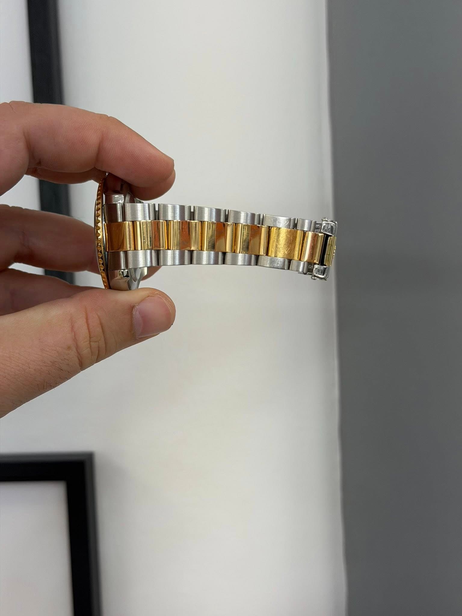 May be an image of wrist watch