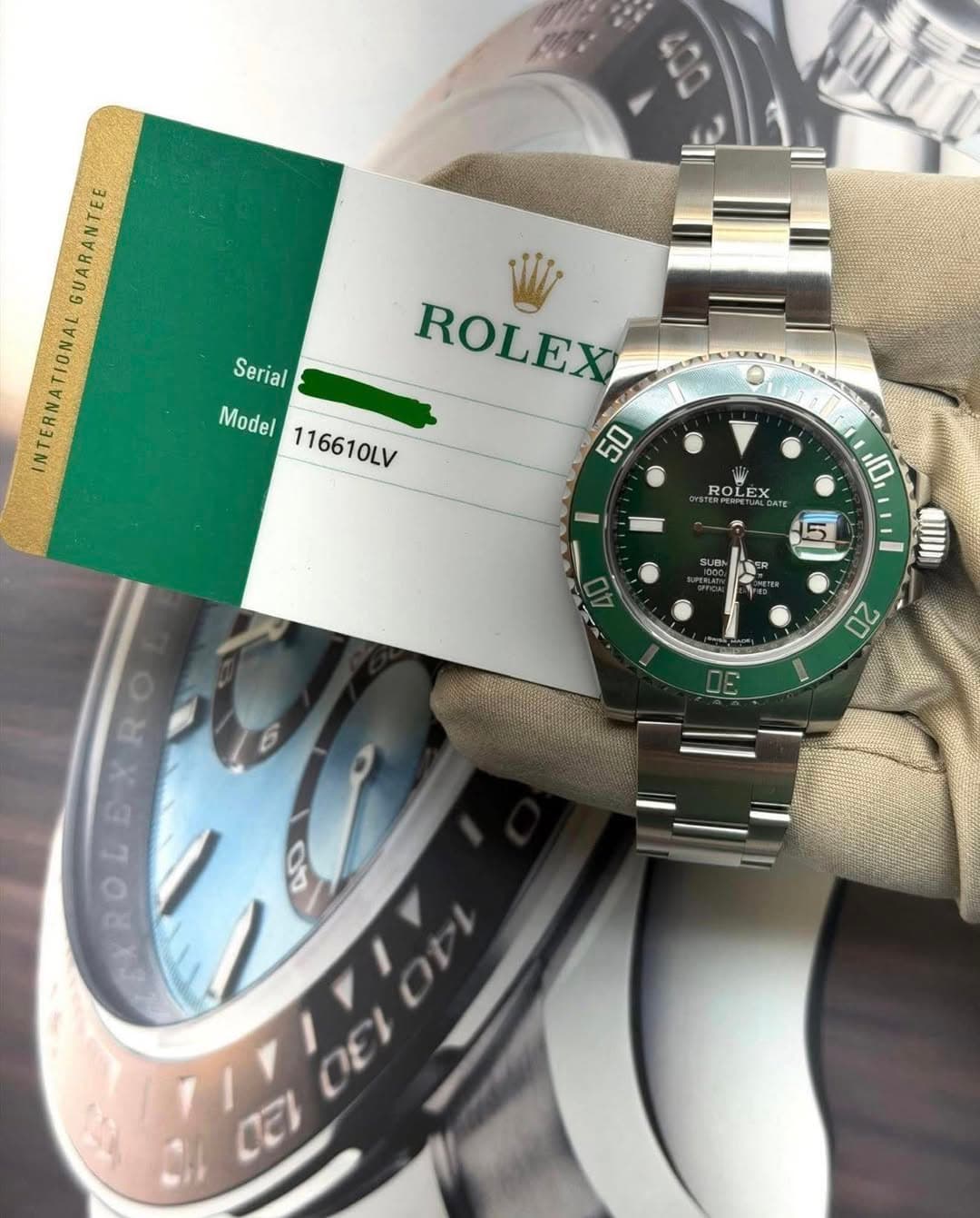 May be an image of wrist watch and text that says 'GUARANTEE INTERNATIONAL W Serial ROLEX Model del116610LV 116610LV 50 Ven 10 ROL ROLEX SUBN 5 20 3 Ca ROL OEI CEI'
