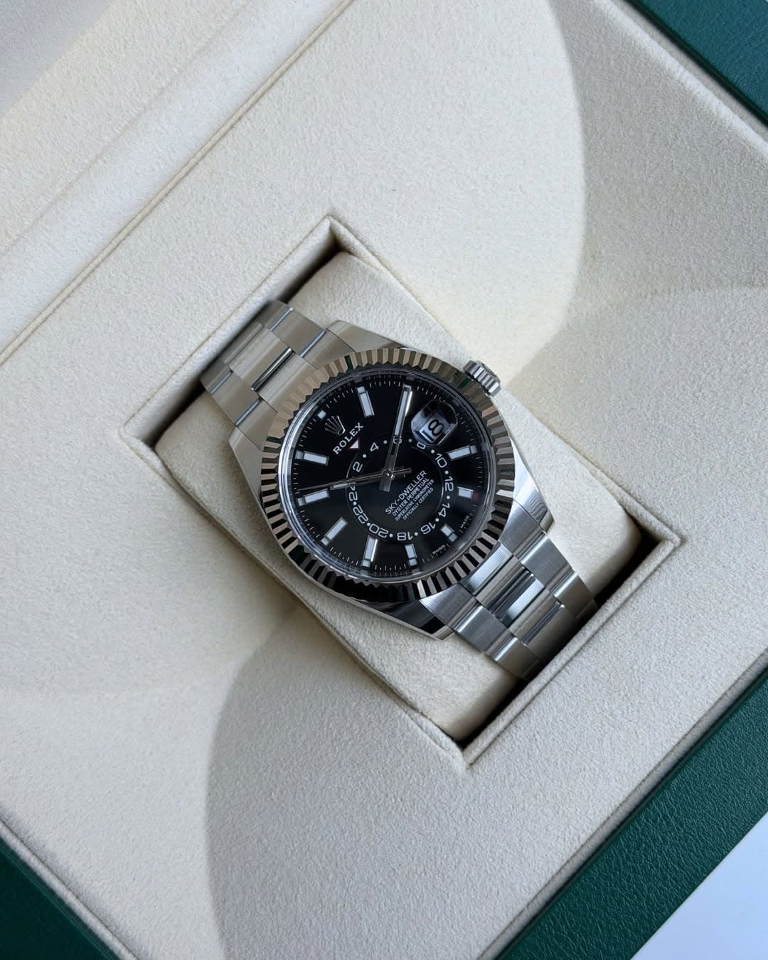 May be an image of wrist watch and text