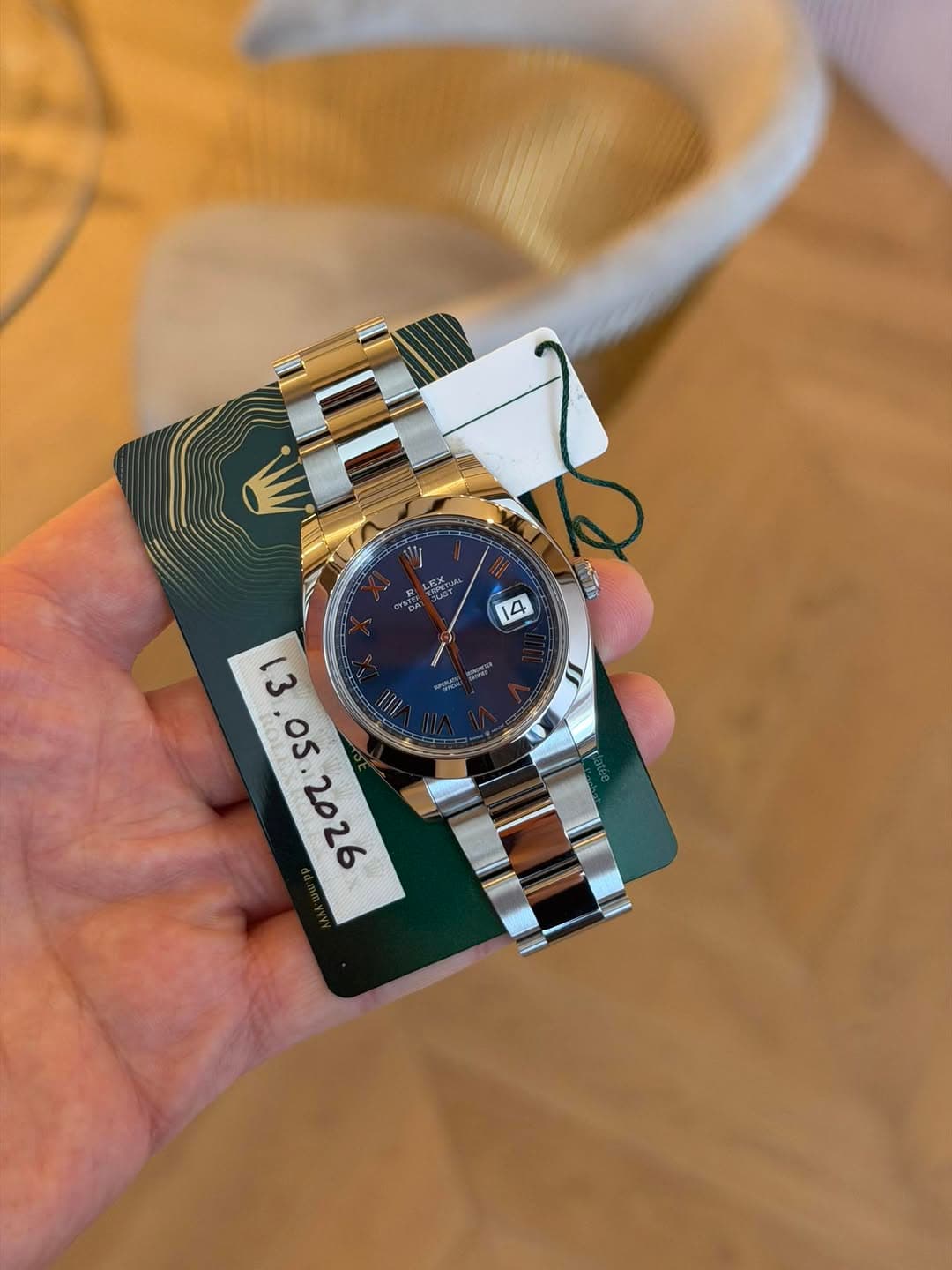 May be an image of wrist watch and text
