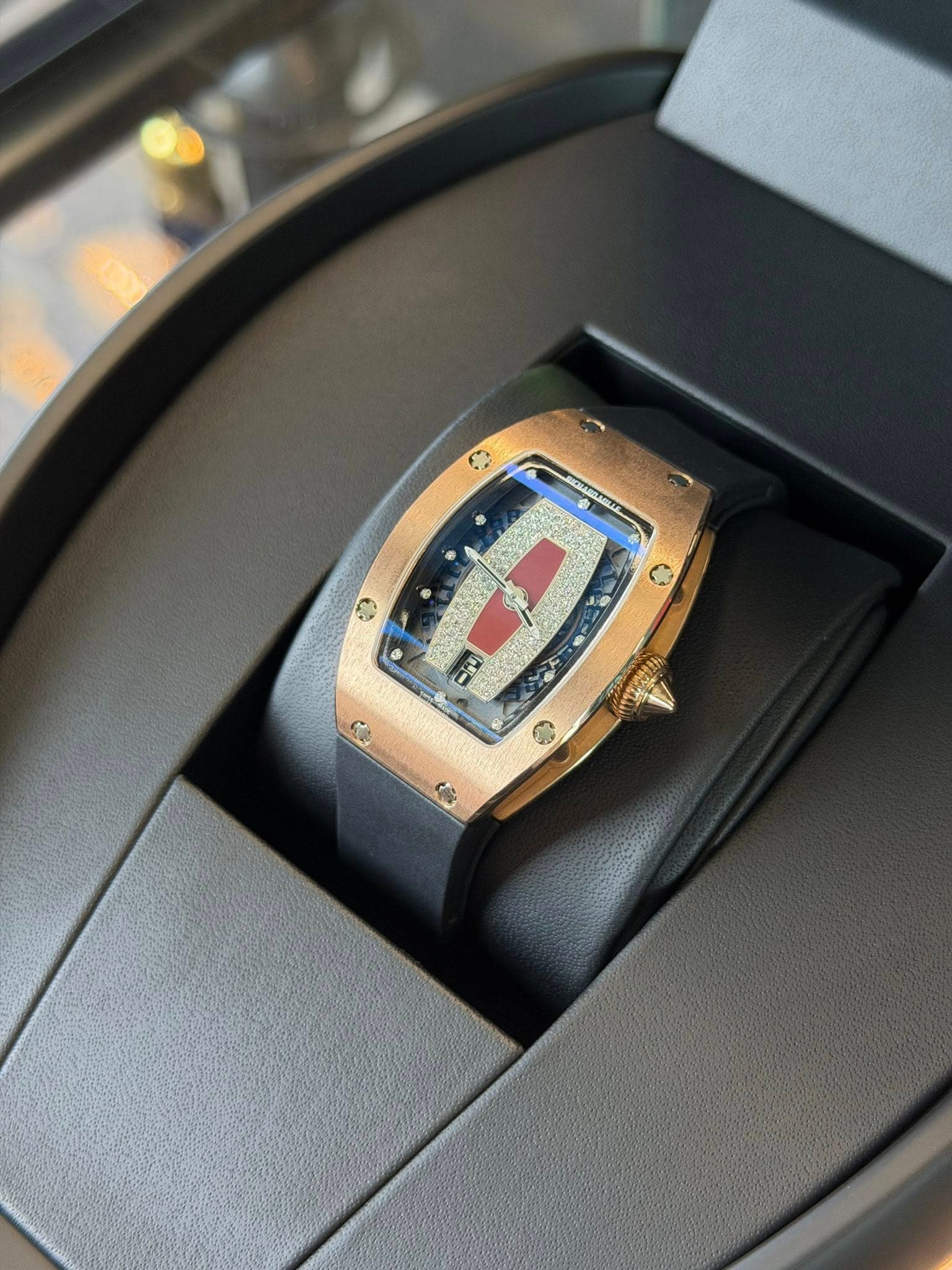 May be an image of wrist watch and text