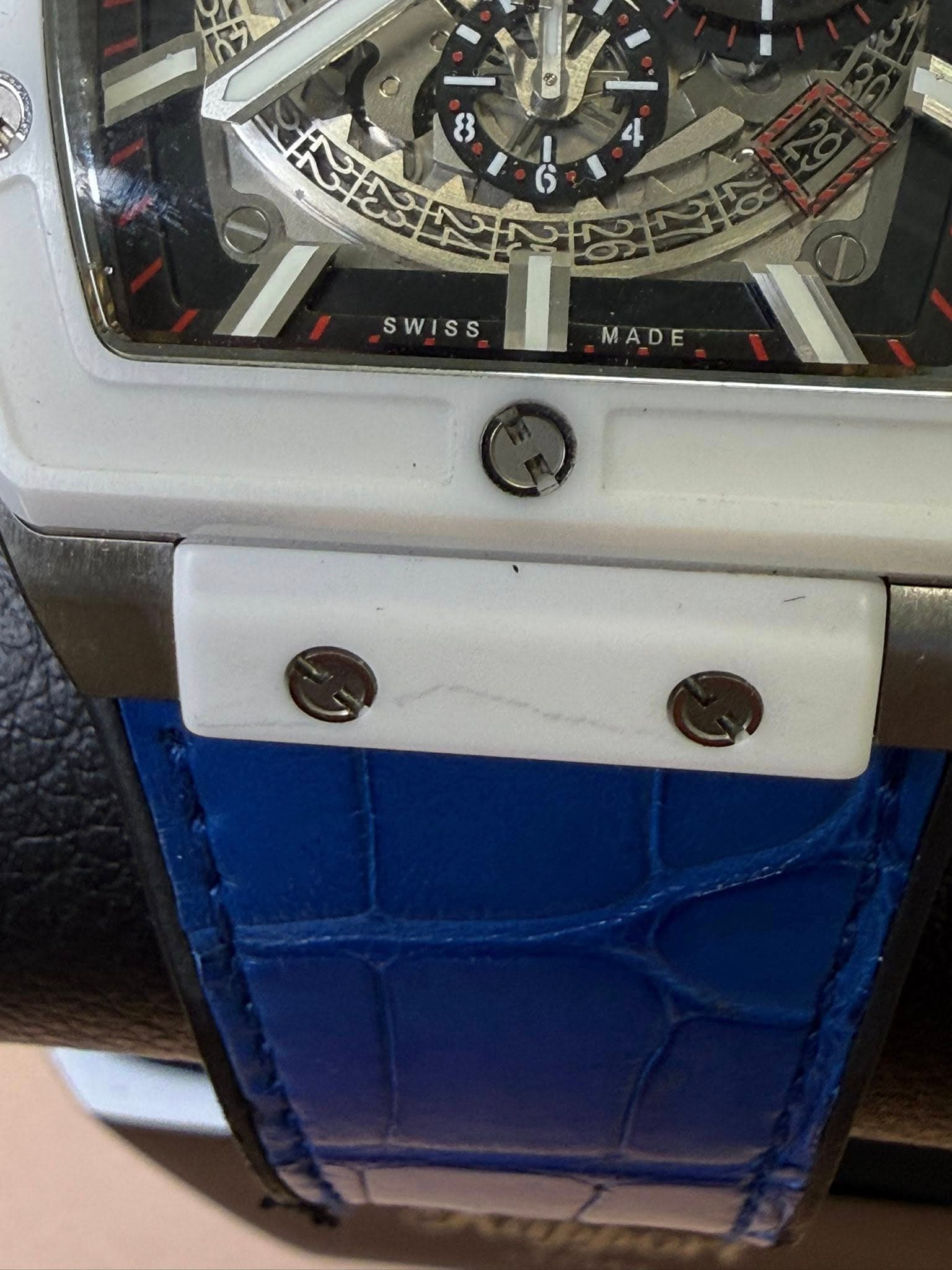 May be an image of wrist watch and text