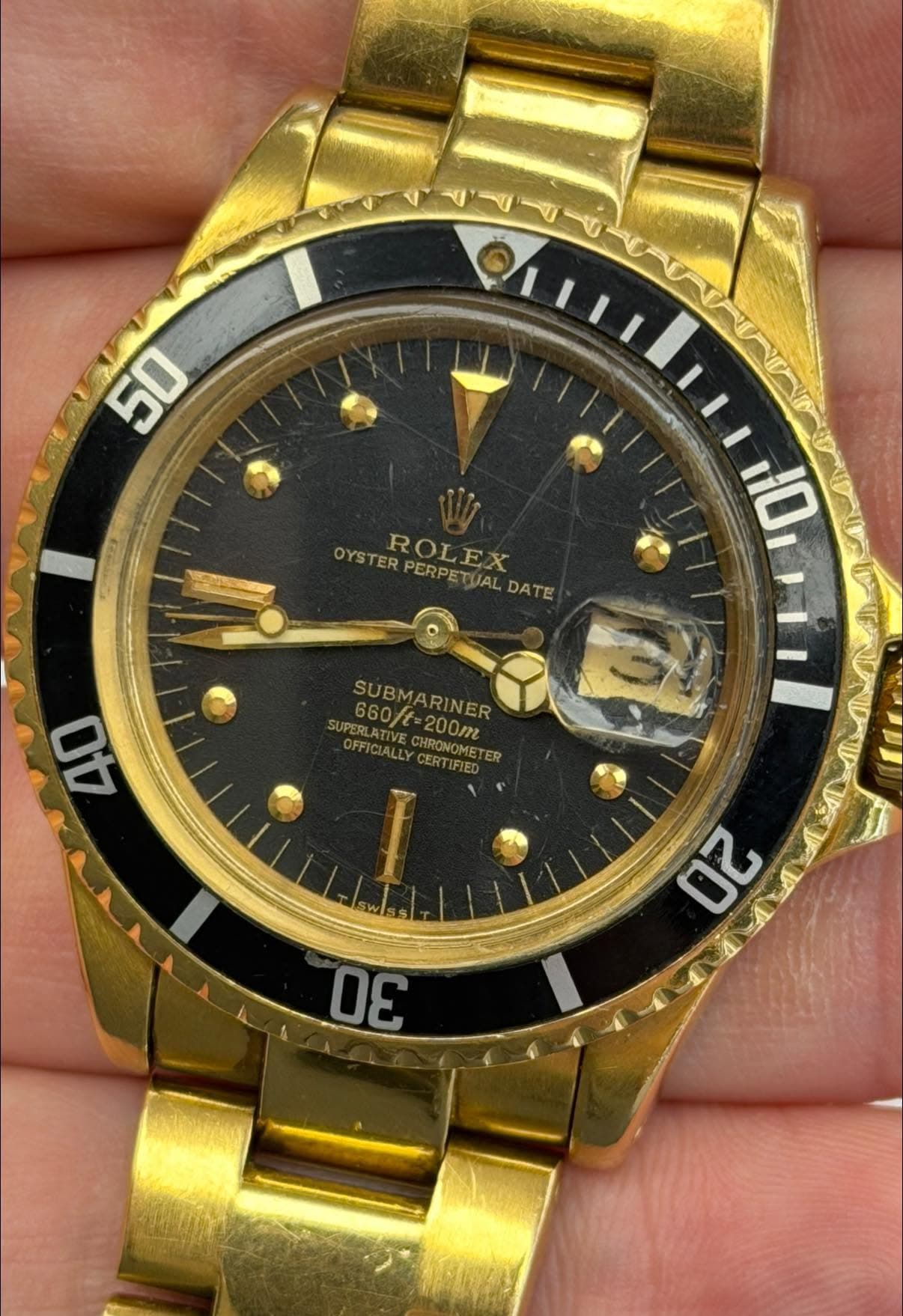 May be an image of wrist watch and text that says '50 OYSTER ROLEX PERPETUAL ROLEX PERPETUALDATE DATE SUA M0wi11 10 40 SUBMARINER 660t 200m SUPERL SUPERLATIVE OFFICIALLY UV CHRON…