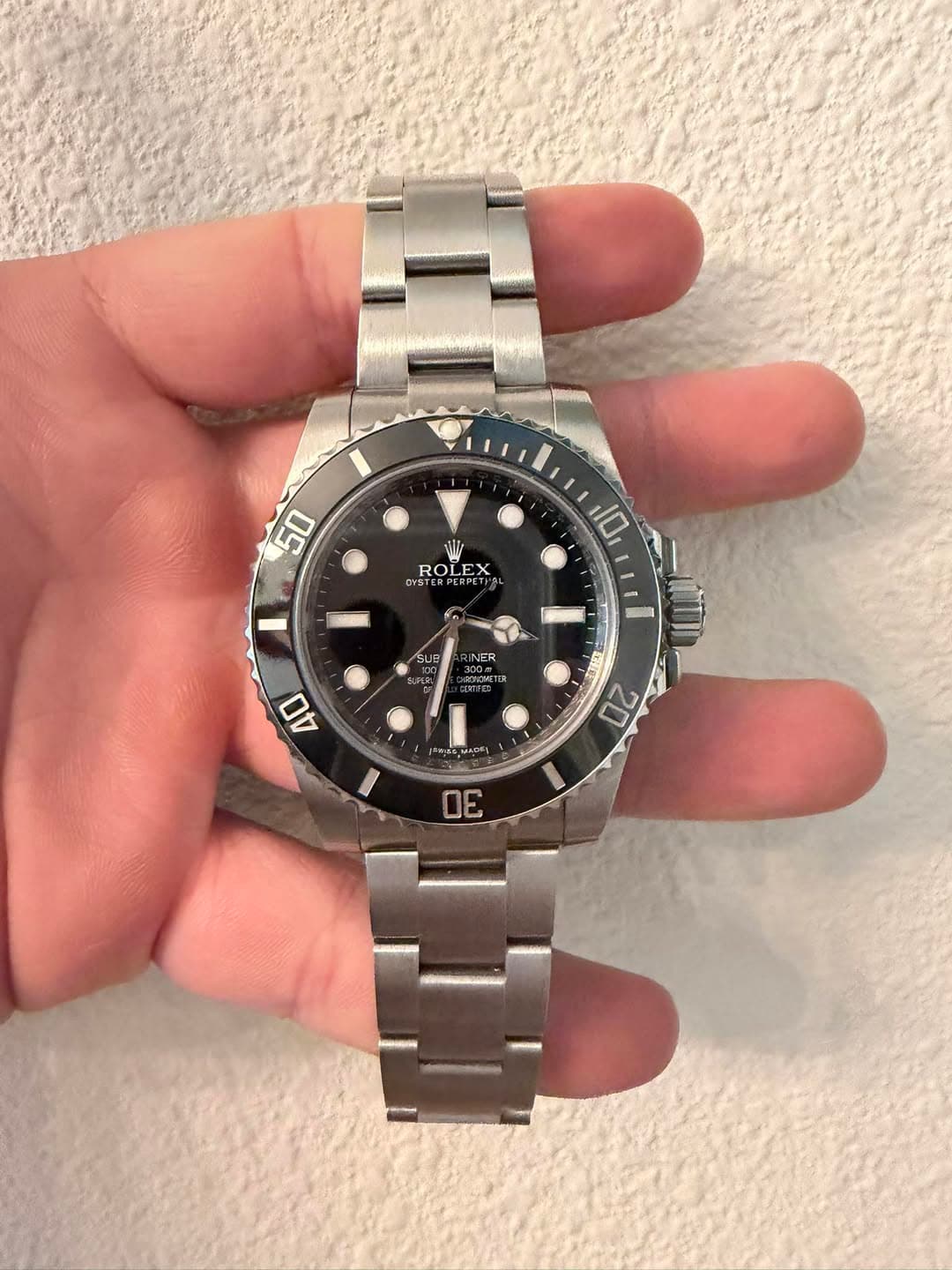 May be an image of wrist watch and text